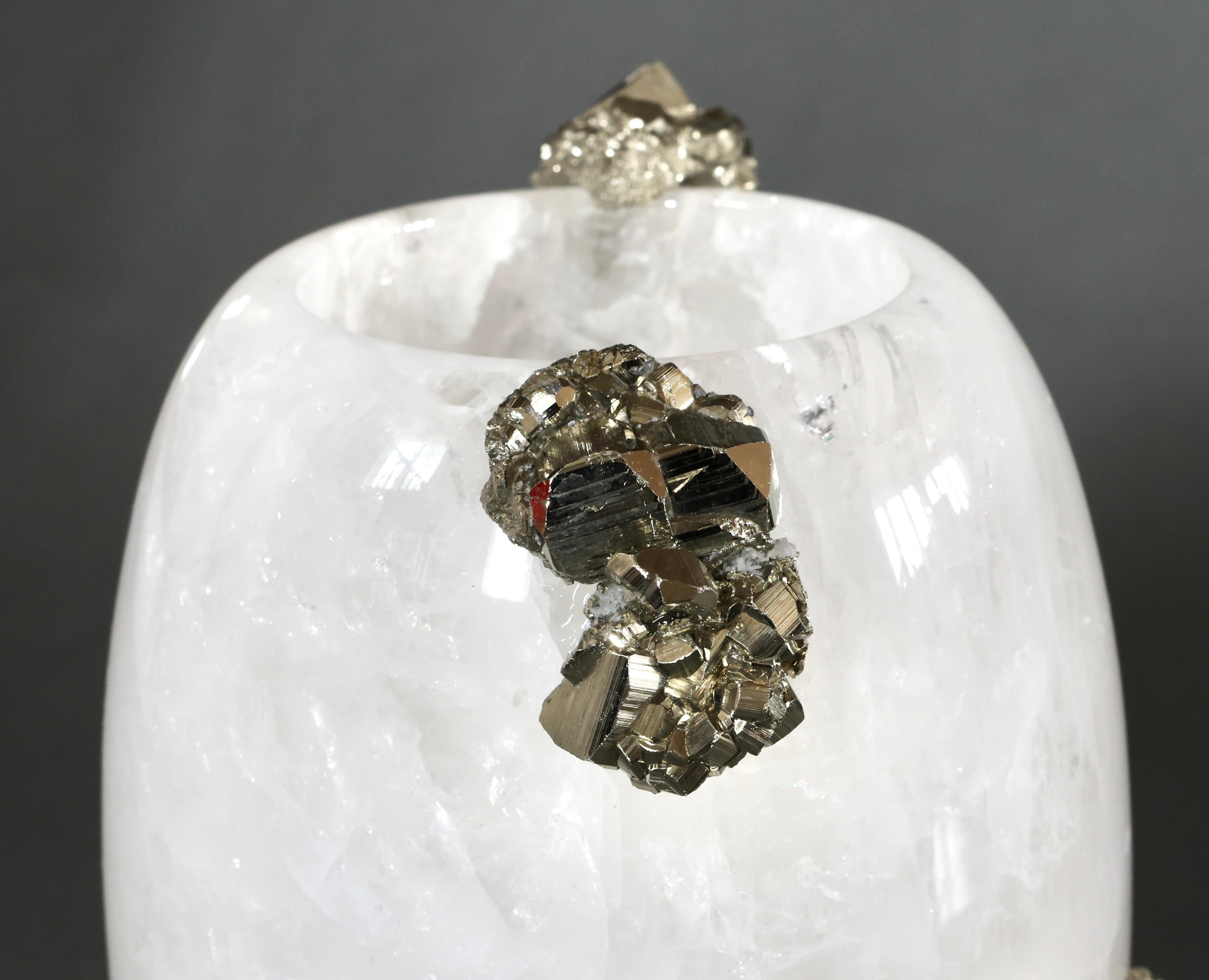 Rock crystal vase with gem stone decoration.
    