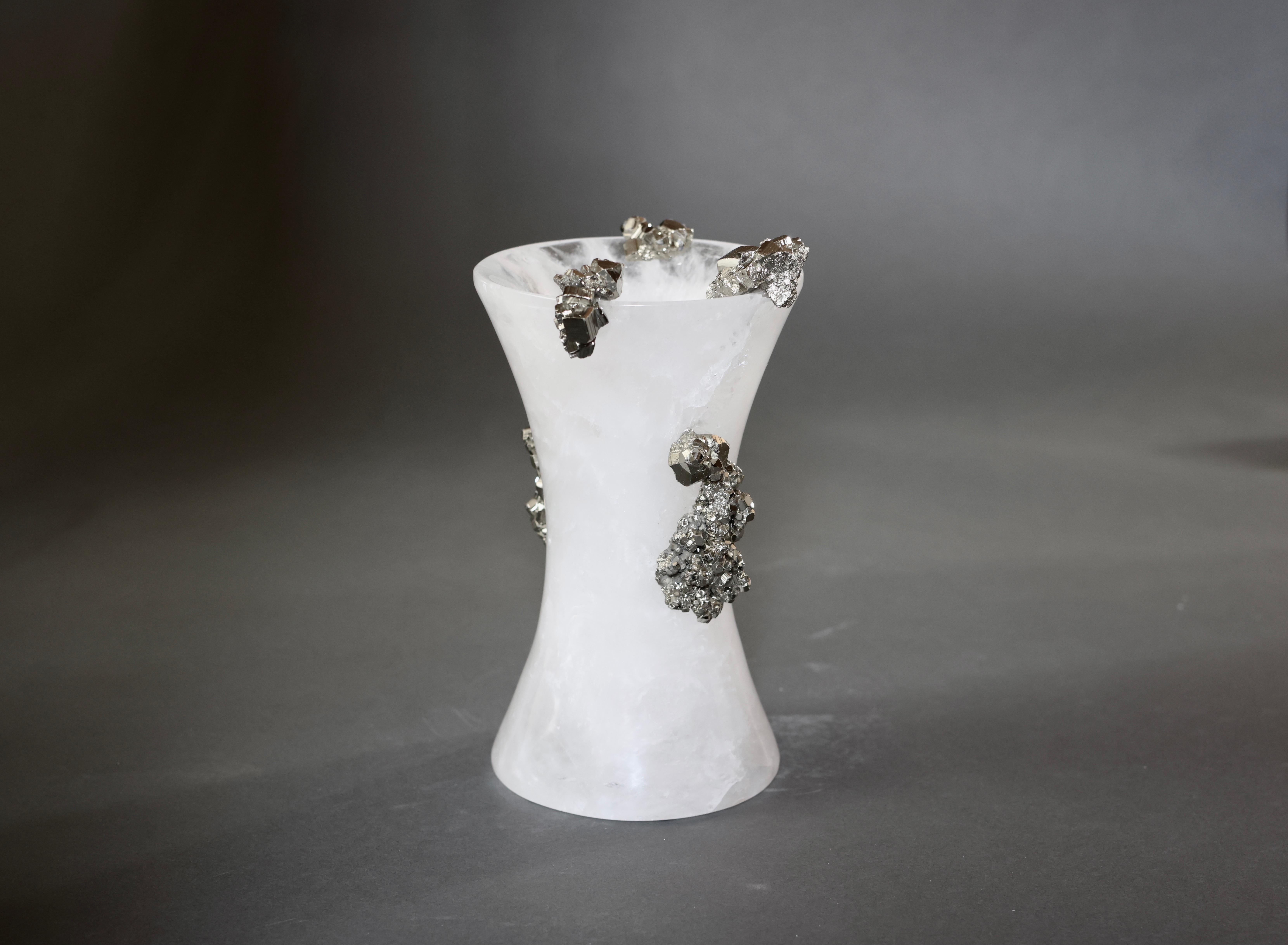 Finely carved rock crystal vase with gem stones decorations.
 
