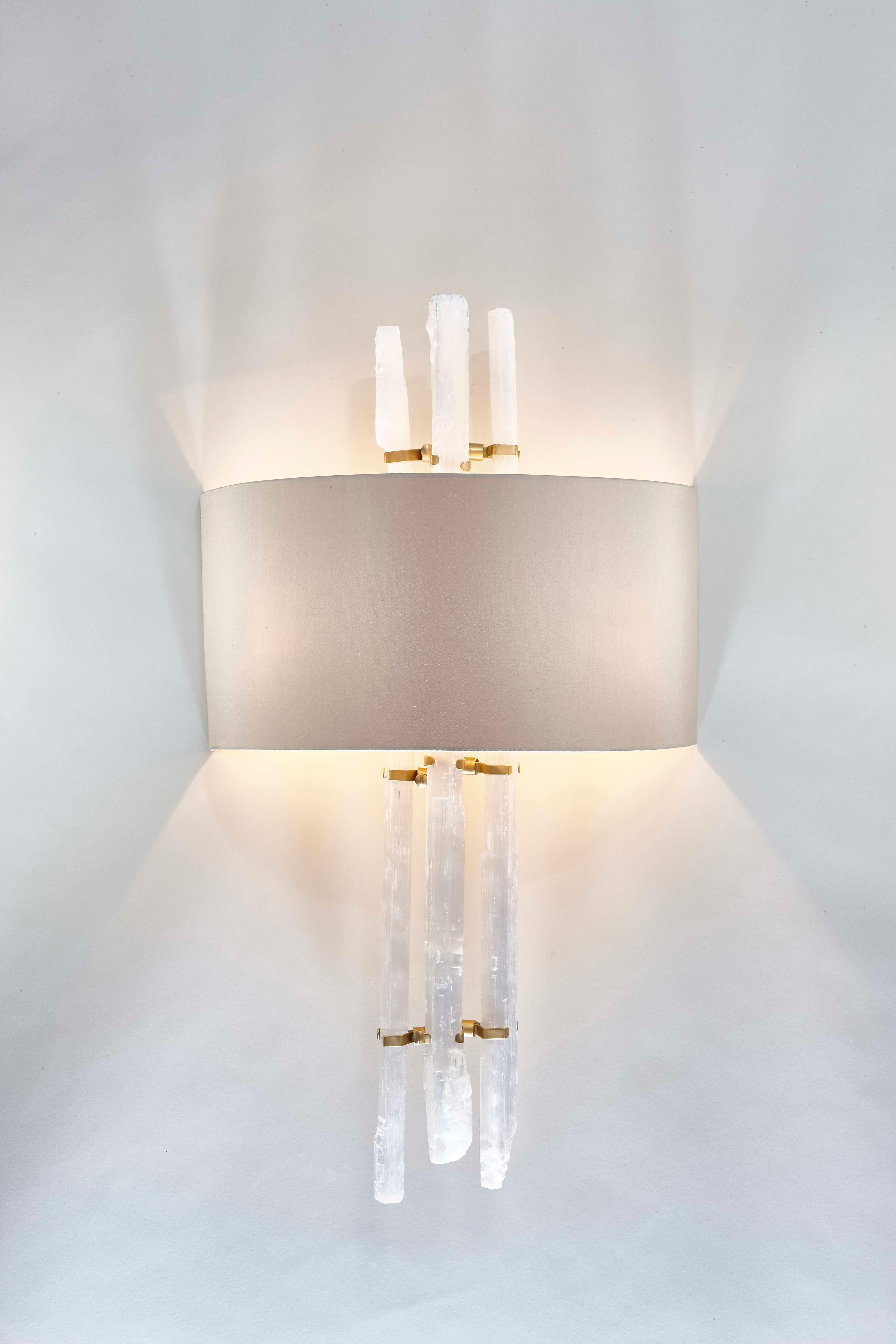 This delicately handcrafted wall light is one of our favourite additions to any interior. Not only is it a beautiful piece of art on the wall, but it also adds a soft extra layer of lower lighting. The bespoke half-shade surrounds long organic rock