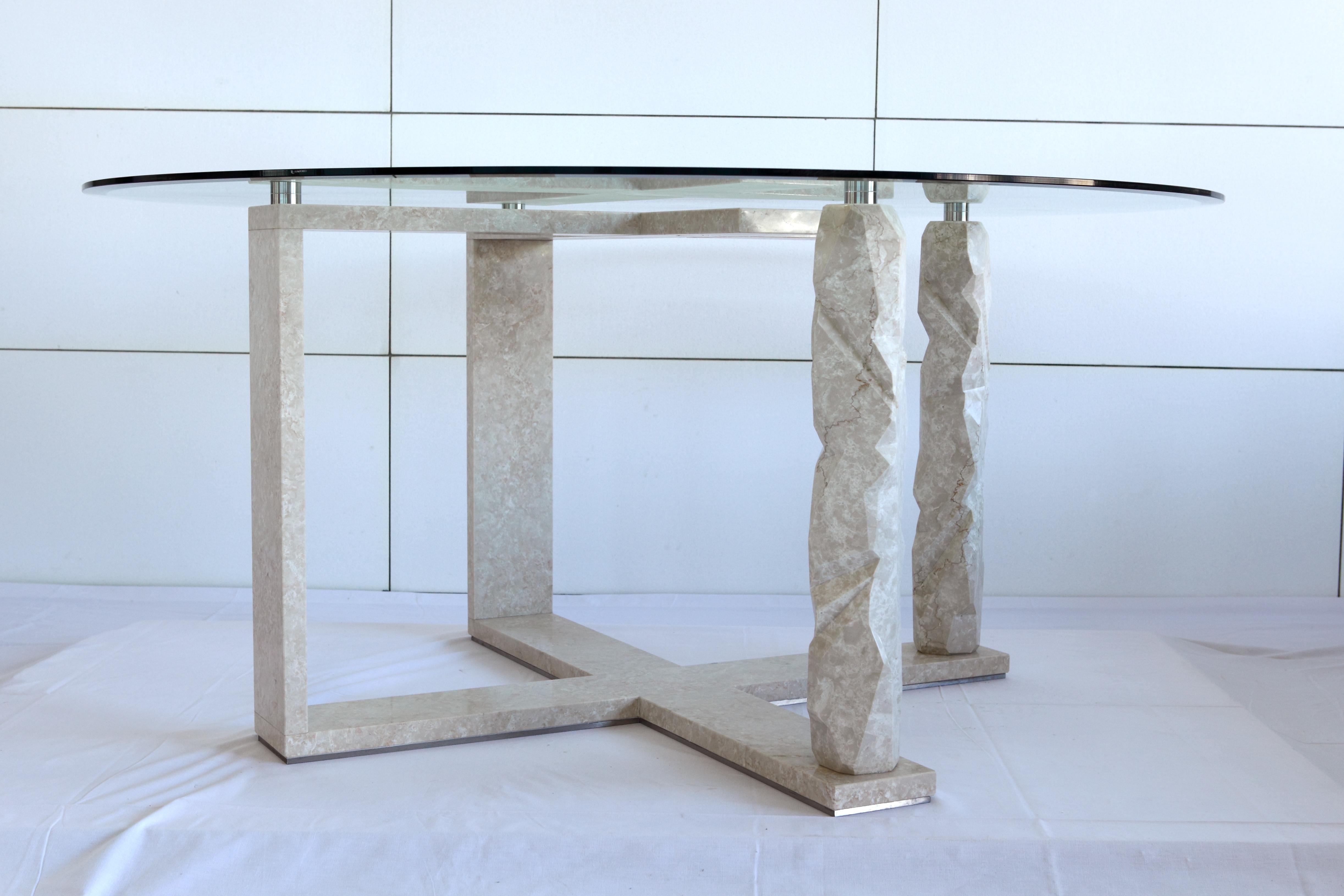 The Rock Frame marble table is a circular table characterized by the peculiarity of its legs.

Made entirely of Bianco Veselye marble, they take the shape of the stone in its raw state, thus outlining a material and contemporary style.

The two