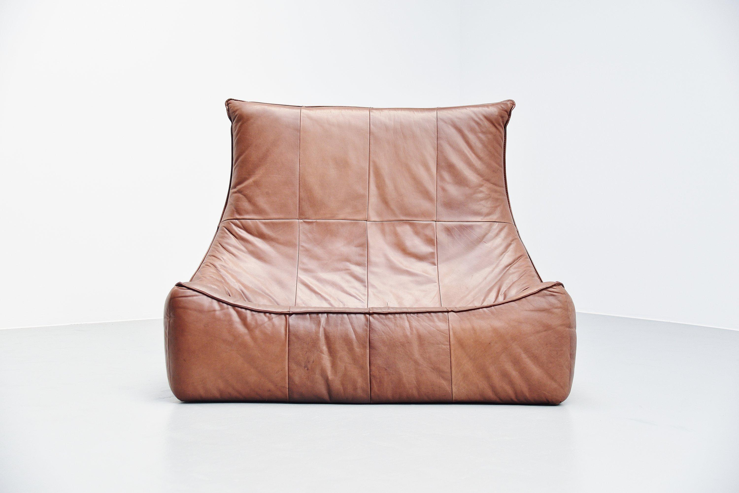 Stunning well known sofa from the so called Rock series, also called the Florence. Designed by Gerard van den Berg and manufactured by Montis, Holland, 1970. This example comes in very nice medium brown buffalo leather and has a splendid patina from