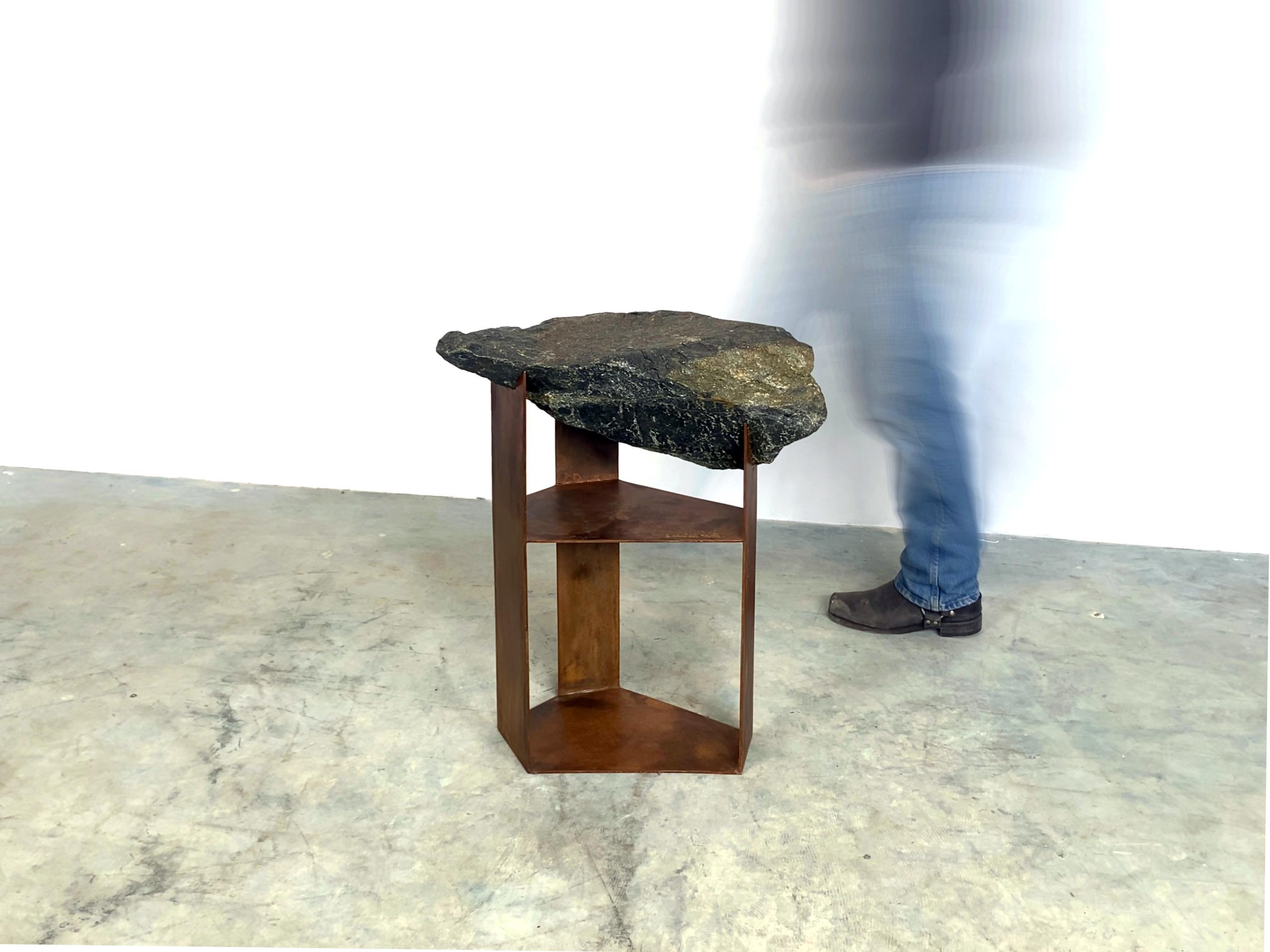Whether you're seeking a functional addition to your living space or an awe-inspiring artwork that sparks conversation, Quinn Morrissette's side table is sure to surpass your expectations. With its rustic yet contemporary design, this piece