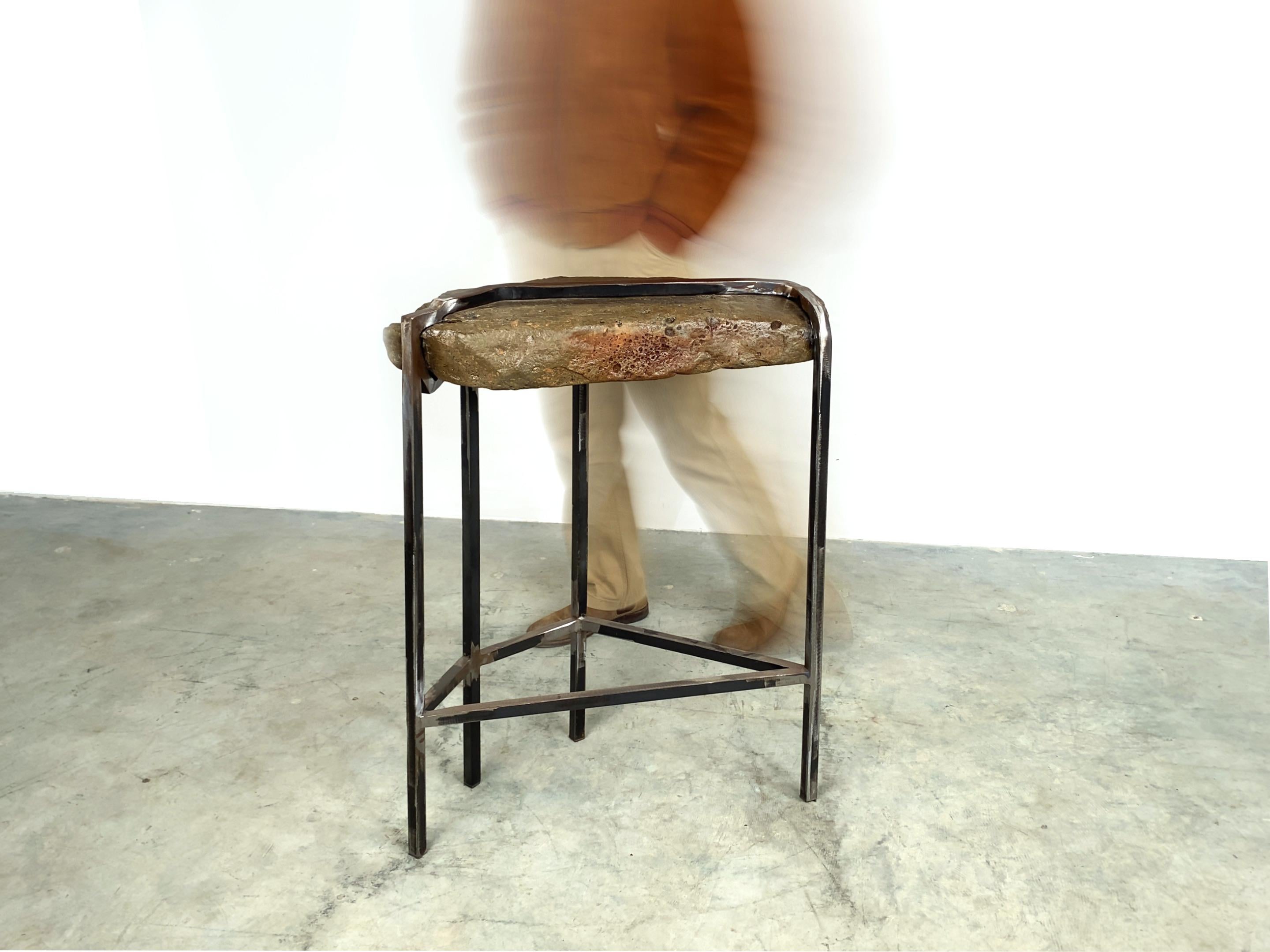 A stunning rock table made by Quinn Morrissette, an artist whose studio embraces the beauty of raw materials in sculptural objects. This remarkable piece is a testament to the artist's mantra, 
