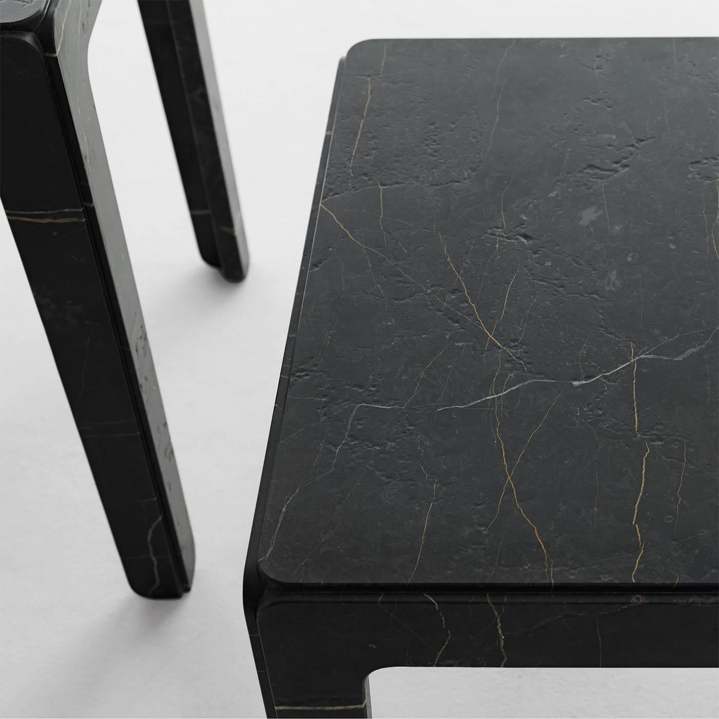 Part of the Rock collection, designed by Alberto Colzani in 2015, this tall side table is crafted entirely of New Saint Laurent marble (also available in Carrara o Cipollino). The five parts that make up this sophisticated and modern piece - four