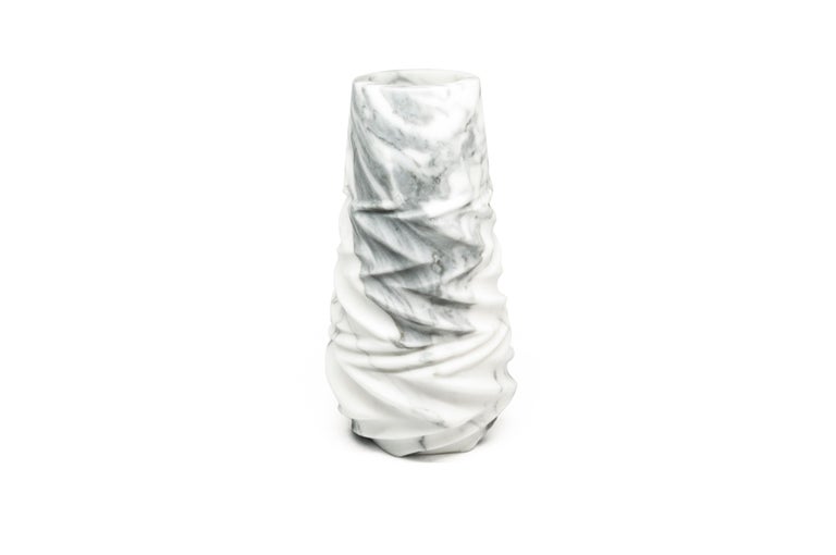 Rock vase in Arabescato marble. 
-Jacopo Simonetti Design for FiammettaV-
Each piece is in a way unique (every marble block is different in veins and shades) and handmade by Italian artisans specialized over generations in processing marble.