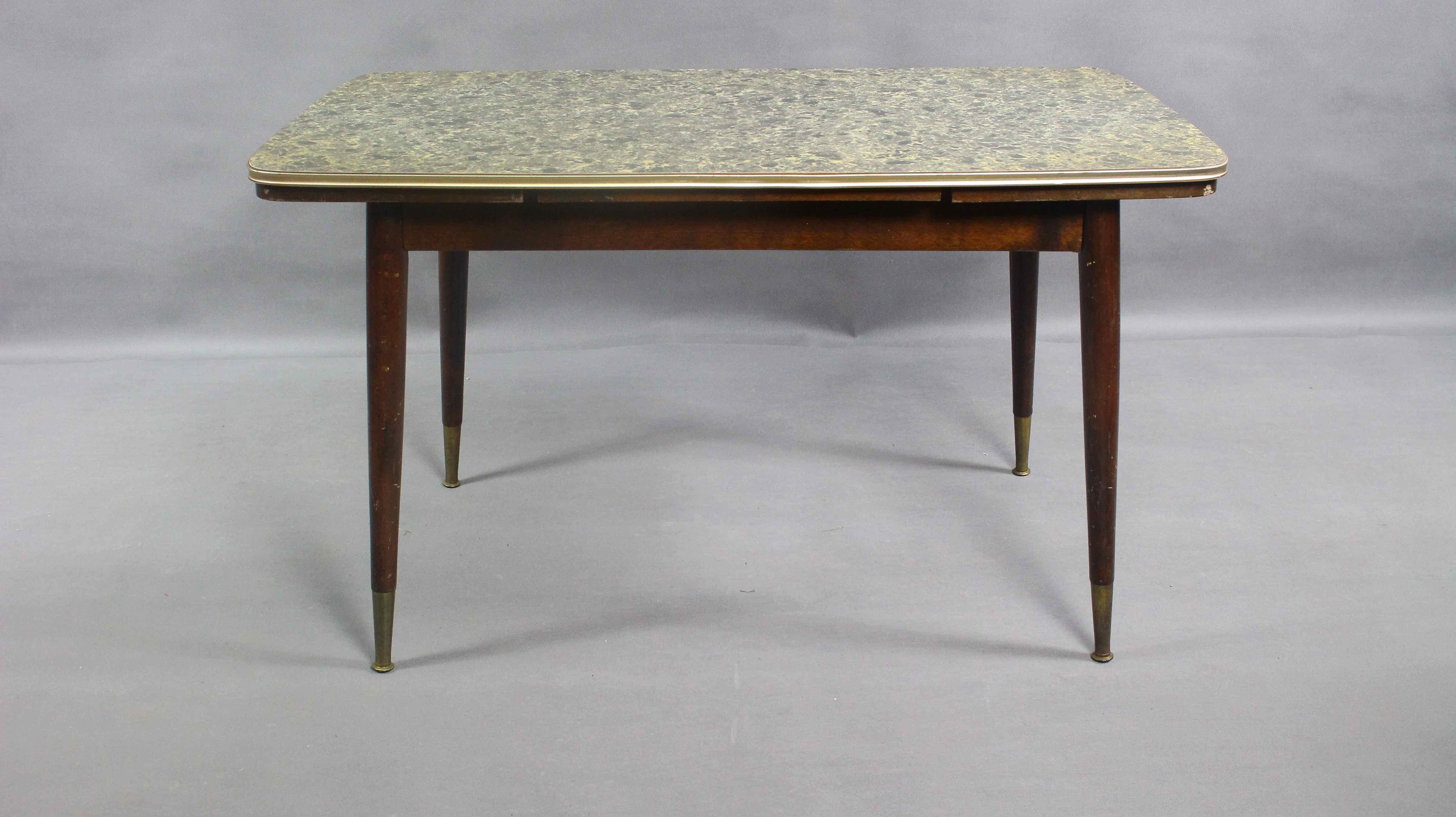 Rockabilly adjusted table from the 1560s.
In original and good condition.
Traces of use, minor damage to the veneer.
Table dimensions after unfolding and raising: Width 180 cm  Height 75 cm.
Table will be unfolded for the shipping.