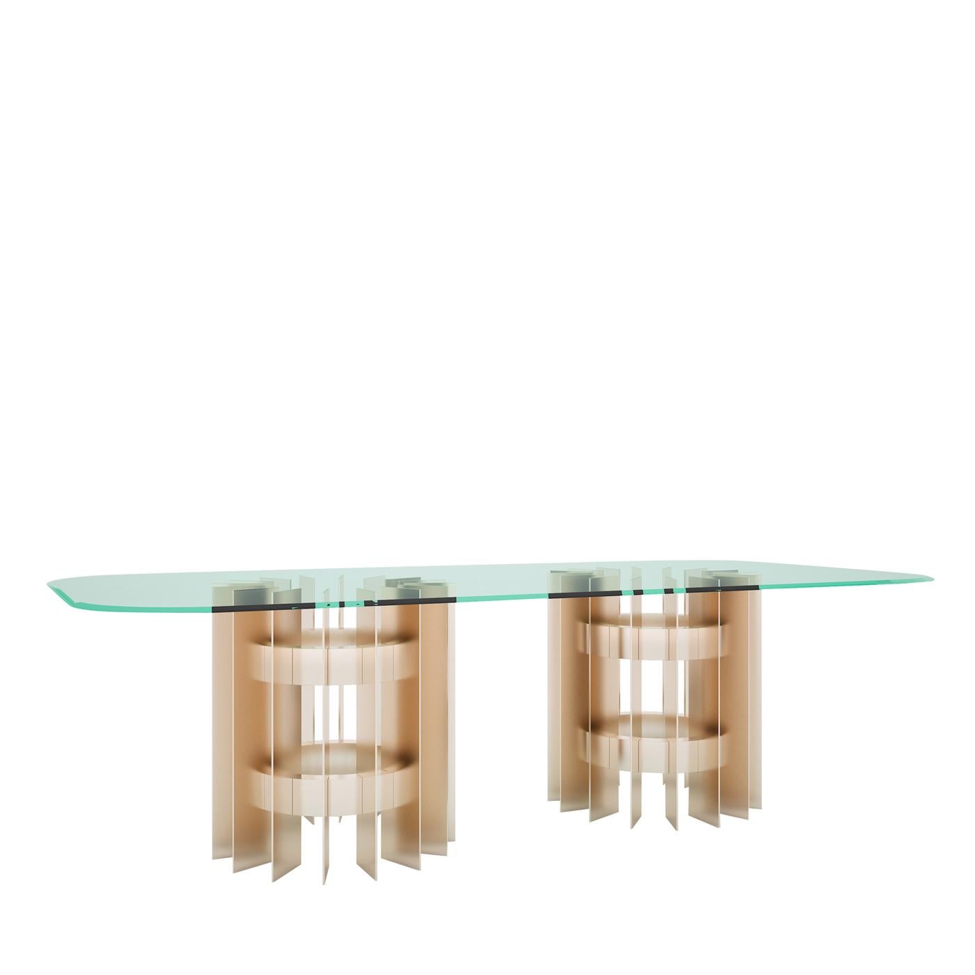 Imposing and delicate at the same time, due to the seductive interplay of voids and solids and transparencies that mark its mesmerizing design, this dining table is a statement piece. The rectangular top (available in different sizes) is in beveled