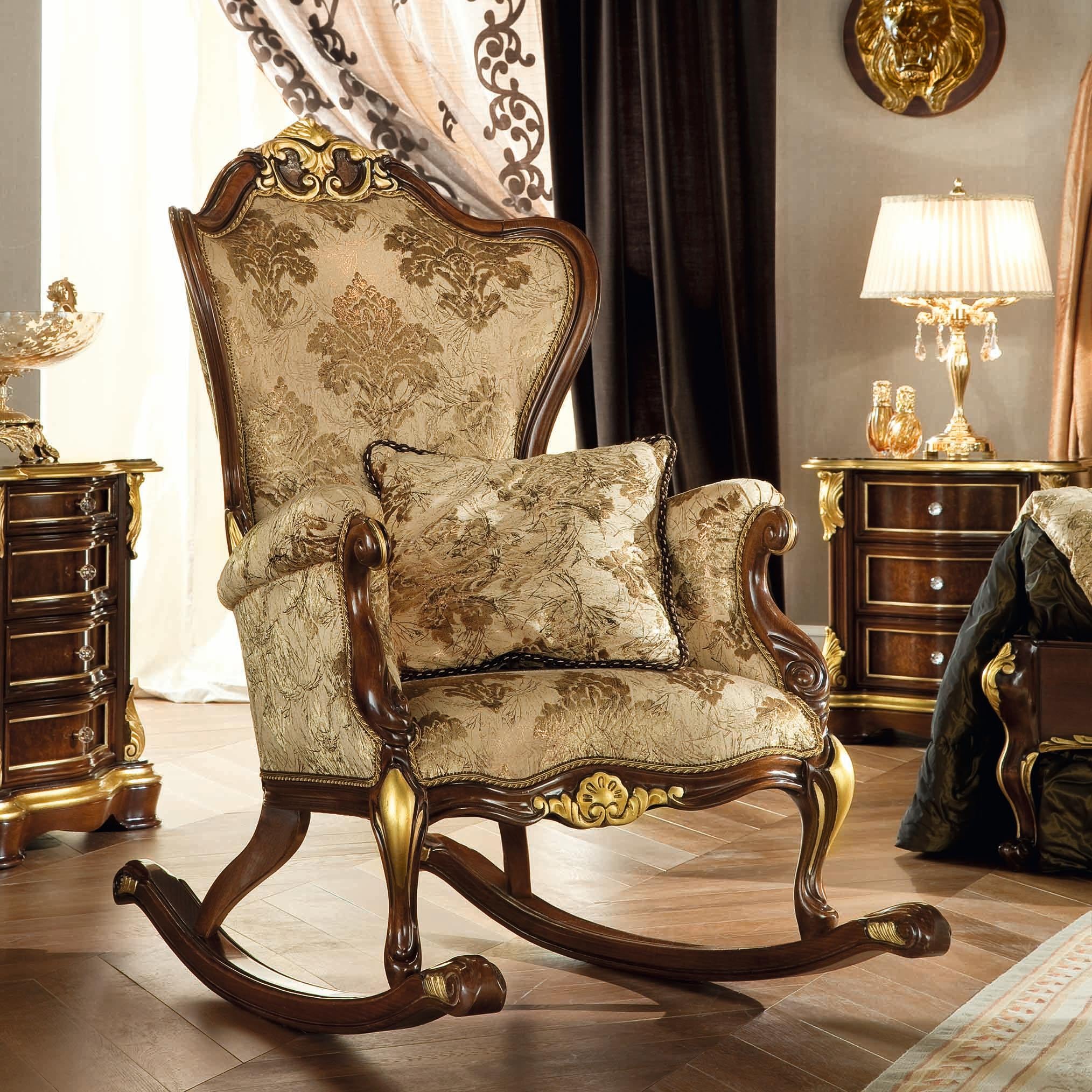 Classy baroque rocking armchair in natural walnut wood and patinated gold leaf finishes. Upholstered with a premium damascus ivory fabric and tested by our specialized employees. Every detail is hand carved by our artisans according to the ancient