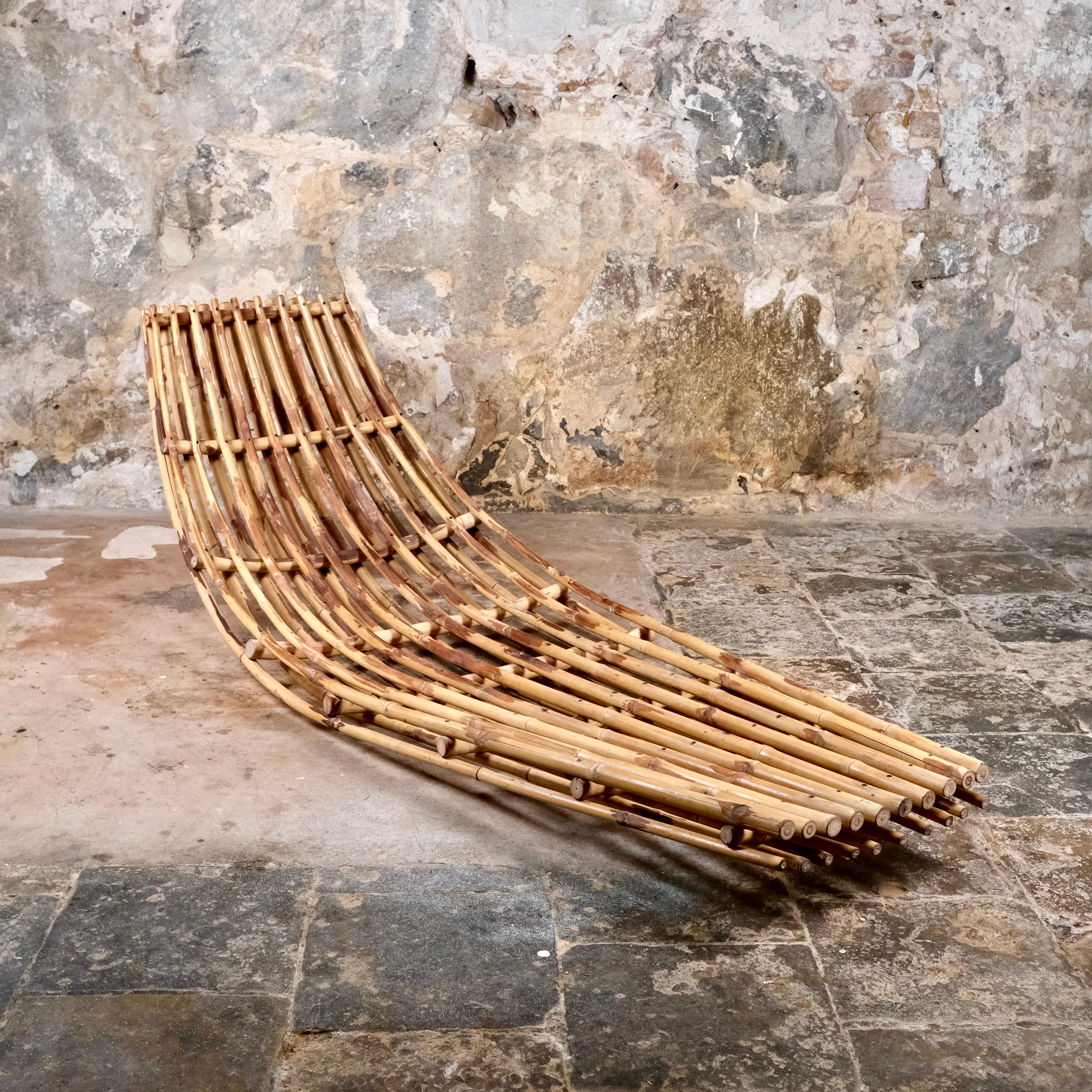 Beautiful rocking bamboo daybed or lounge bed from France, 1970s.
Perfect for indoor or outdoor use, a powerful work.
Good condition, nice patina. 
Sold without mattress.
Dimensions : W200 D78 H65cm
