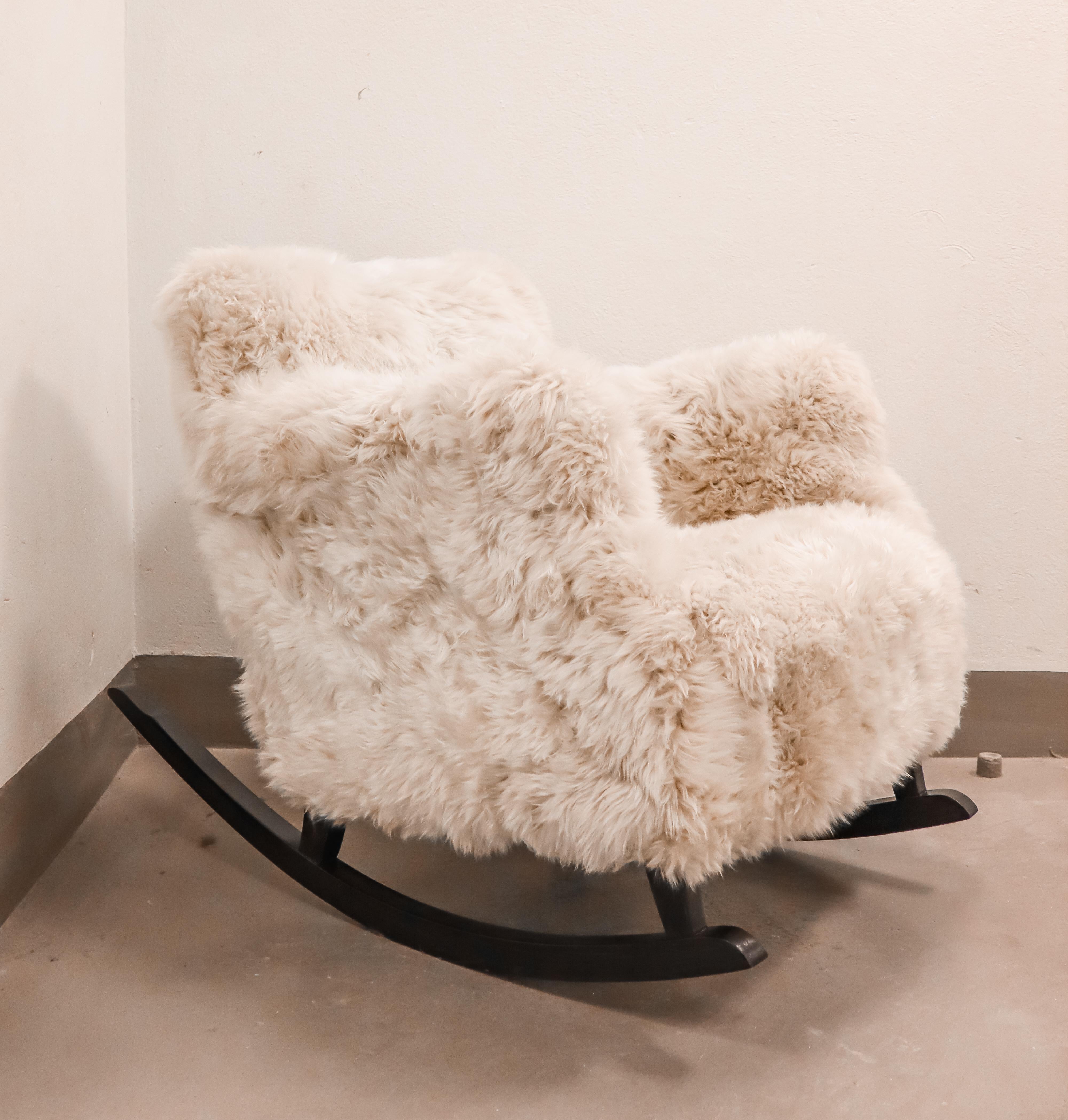 A lovely Rocking chair from the 1930s designed in Sweden. It is reupholstered with sheepskin. It is in excellent condition. 