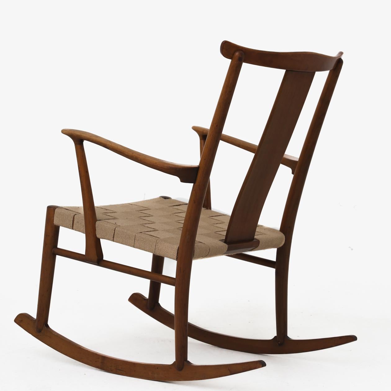 Model 1773 - Rocking chair in stained beech and seat in new natural wood. Designed in 1942. Axel O. Larsen / Fritz Hansen.
