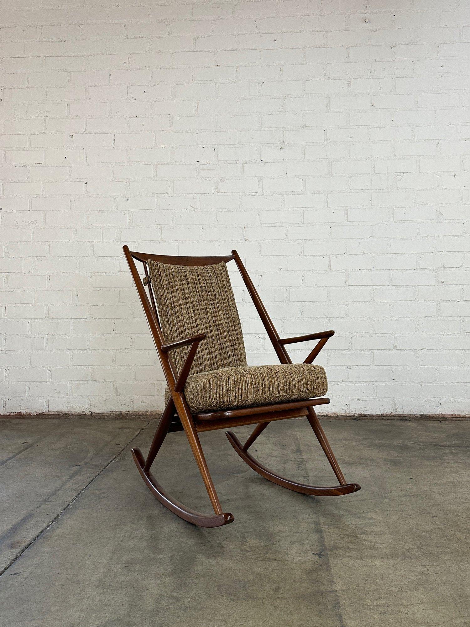 W24 D31 H39 SW119 SD18.5 SH21 AH24

Vintage rocking chair in fully restored condition. Item features new soft textured fabric and new foam. Walnut frame is structurally sound and sturdy with no visible breaks. 