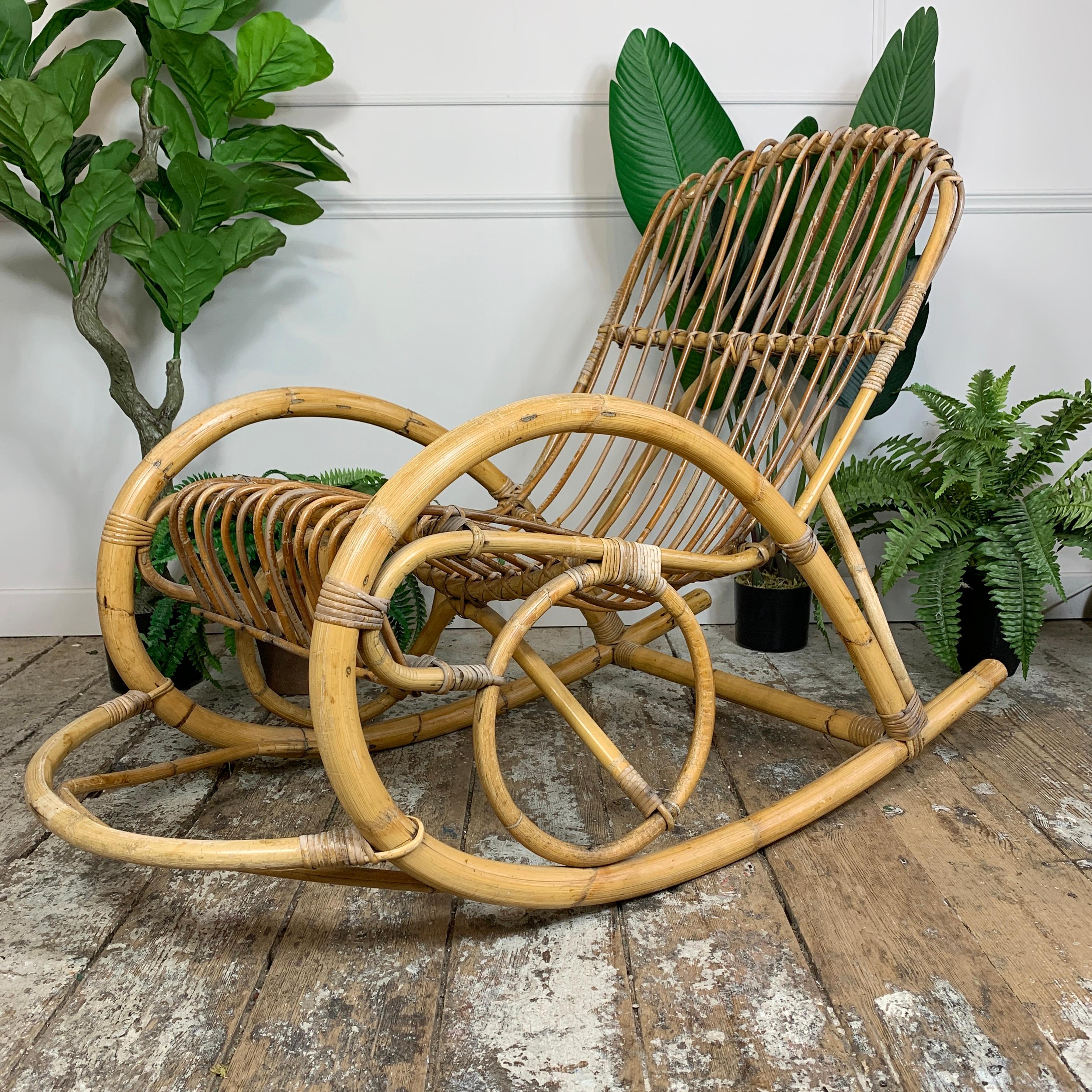 A wonderful 1950’s bent bamboo and rattan high backed rocking chair, very much in the style of Franco Albini’s ‘Rocking Chaise’ for Poggi, all canework and rattan ties are in good condition, the wear is commensurate with the age of the