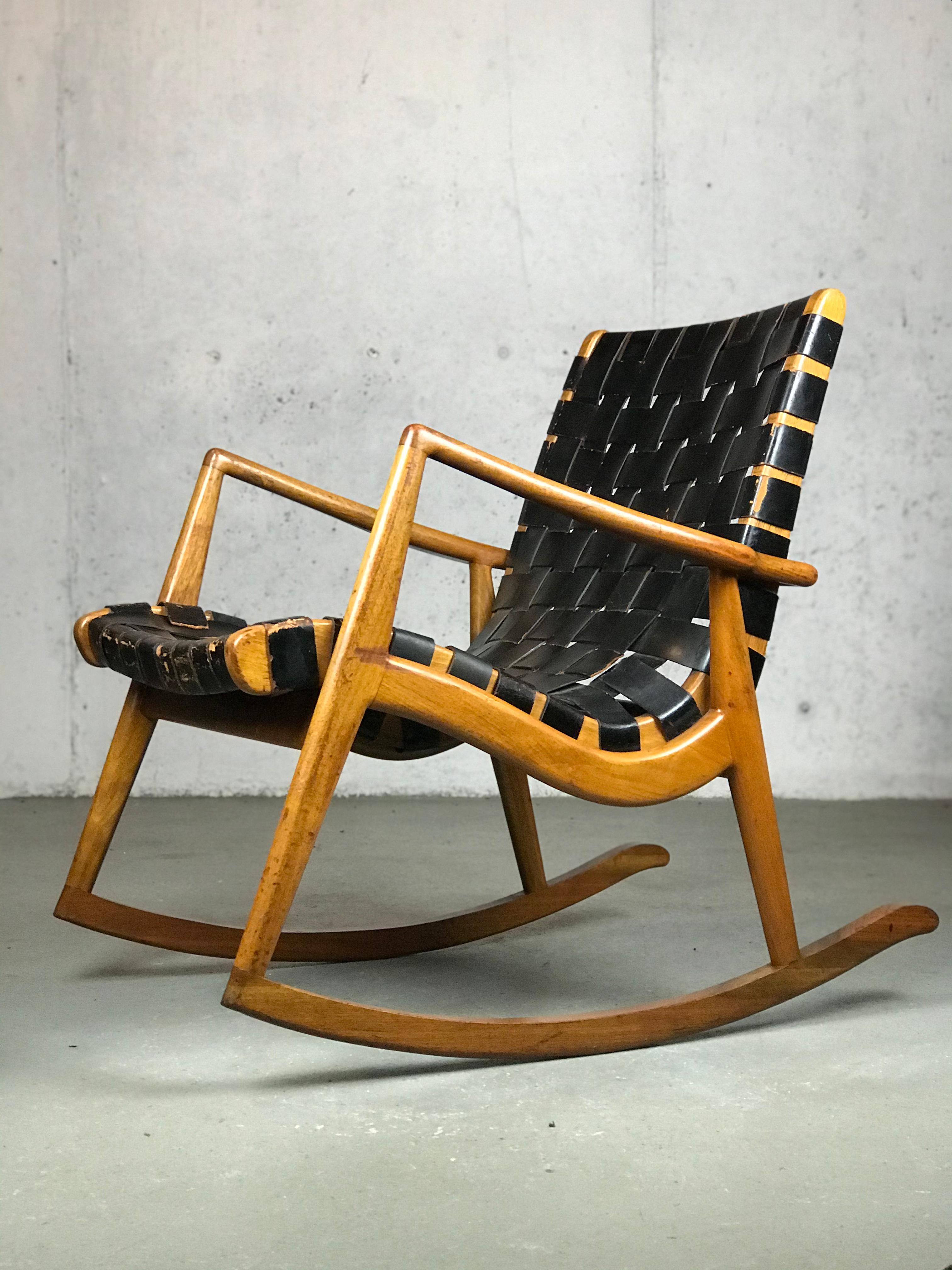 Custom made rocker in leather straps and walnut by Mel Smilow for Smilow-Thiel Furniture - 1950s.  When I emailed Mel's daughter, Pam, she said she had never seen the strap lounge in a rocker - and that this may be the only one.  
Original