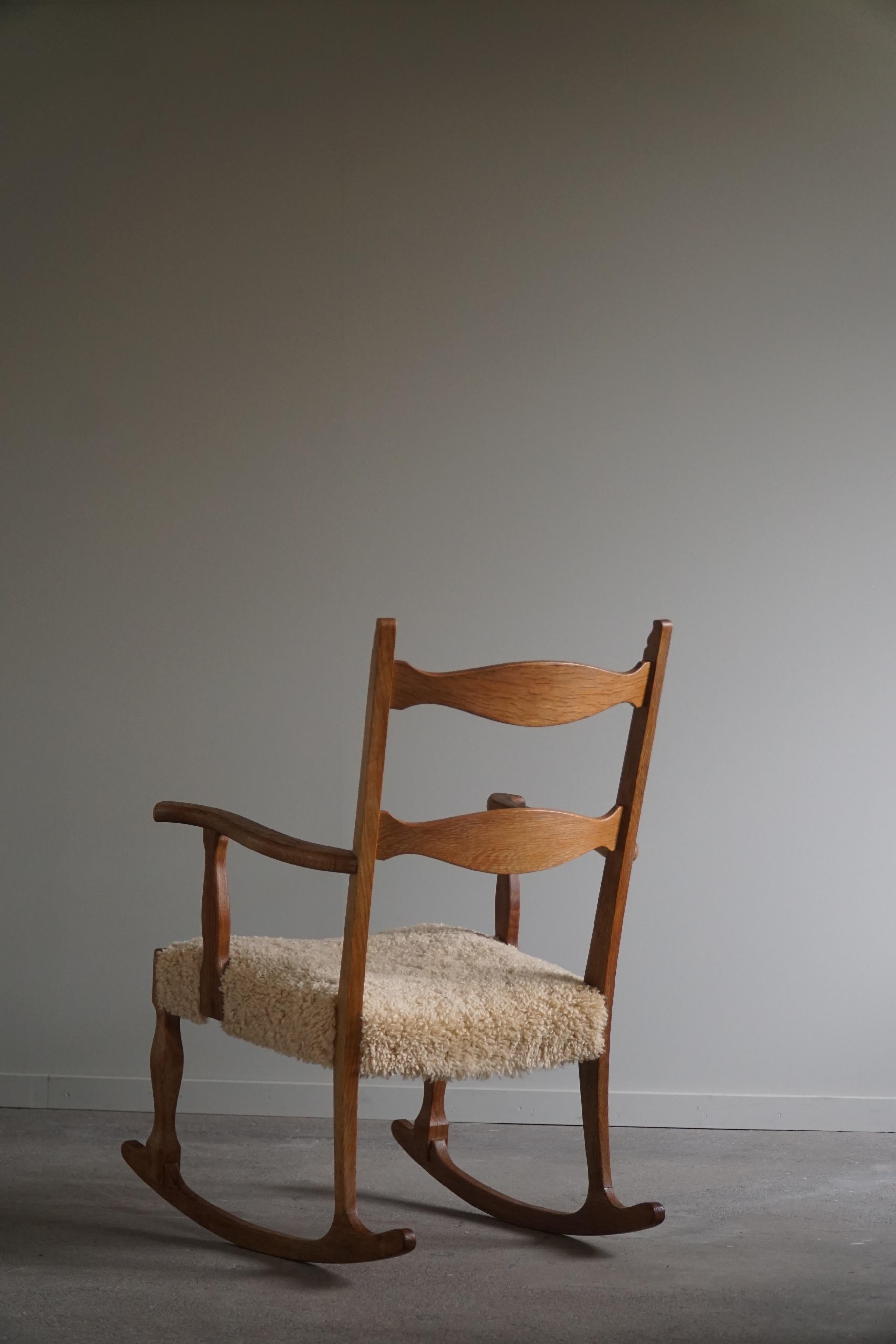 Hand-Crafted Rocking Chair in Oak, Seat Reupholstered in Lambswool, Henning Kjærnulf, 1960s
