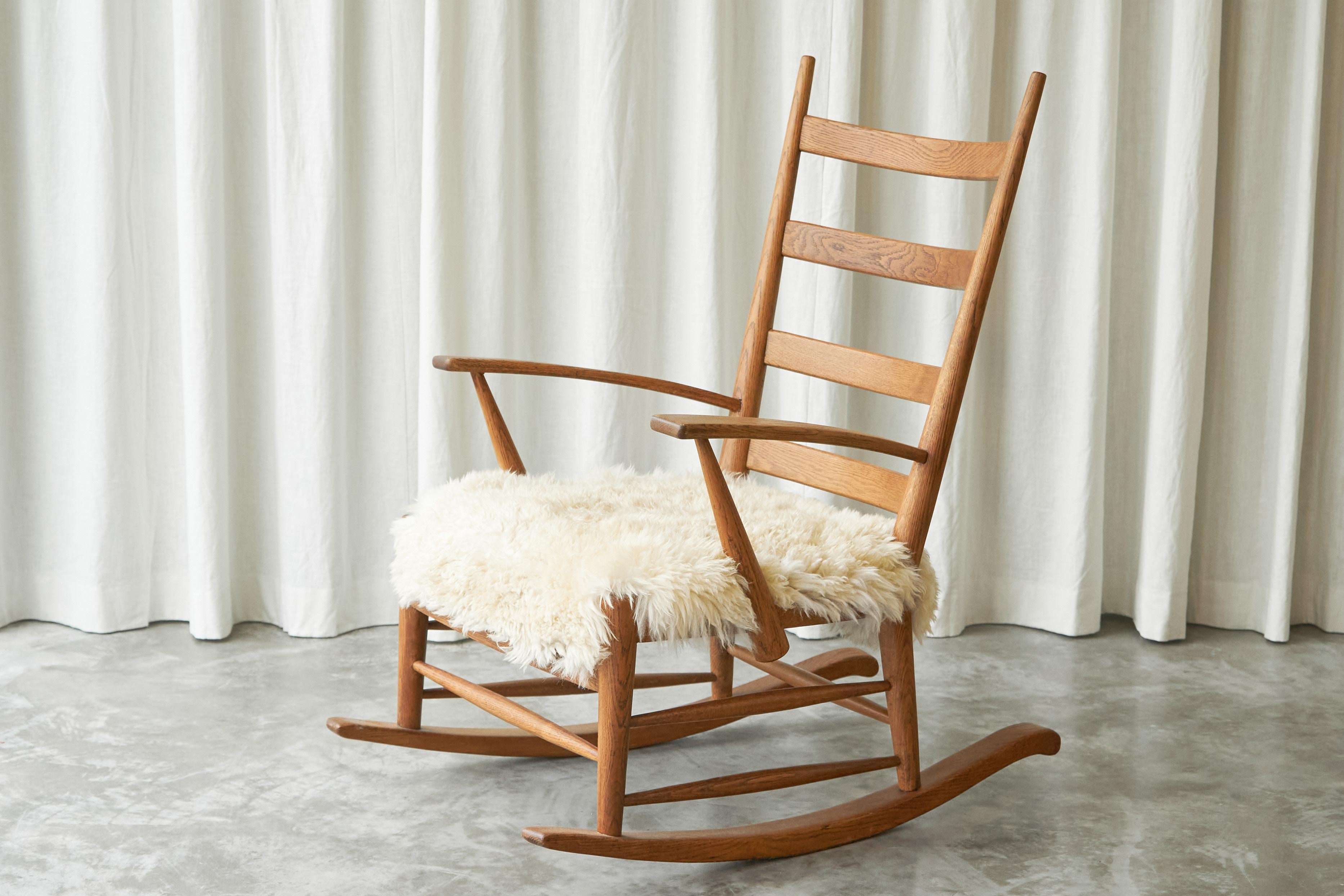 Mid-Century Modern Rocking Chair in Solid Oak and Sheepskin, France 1960s For Sale