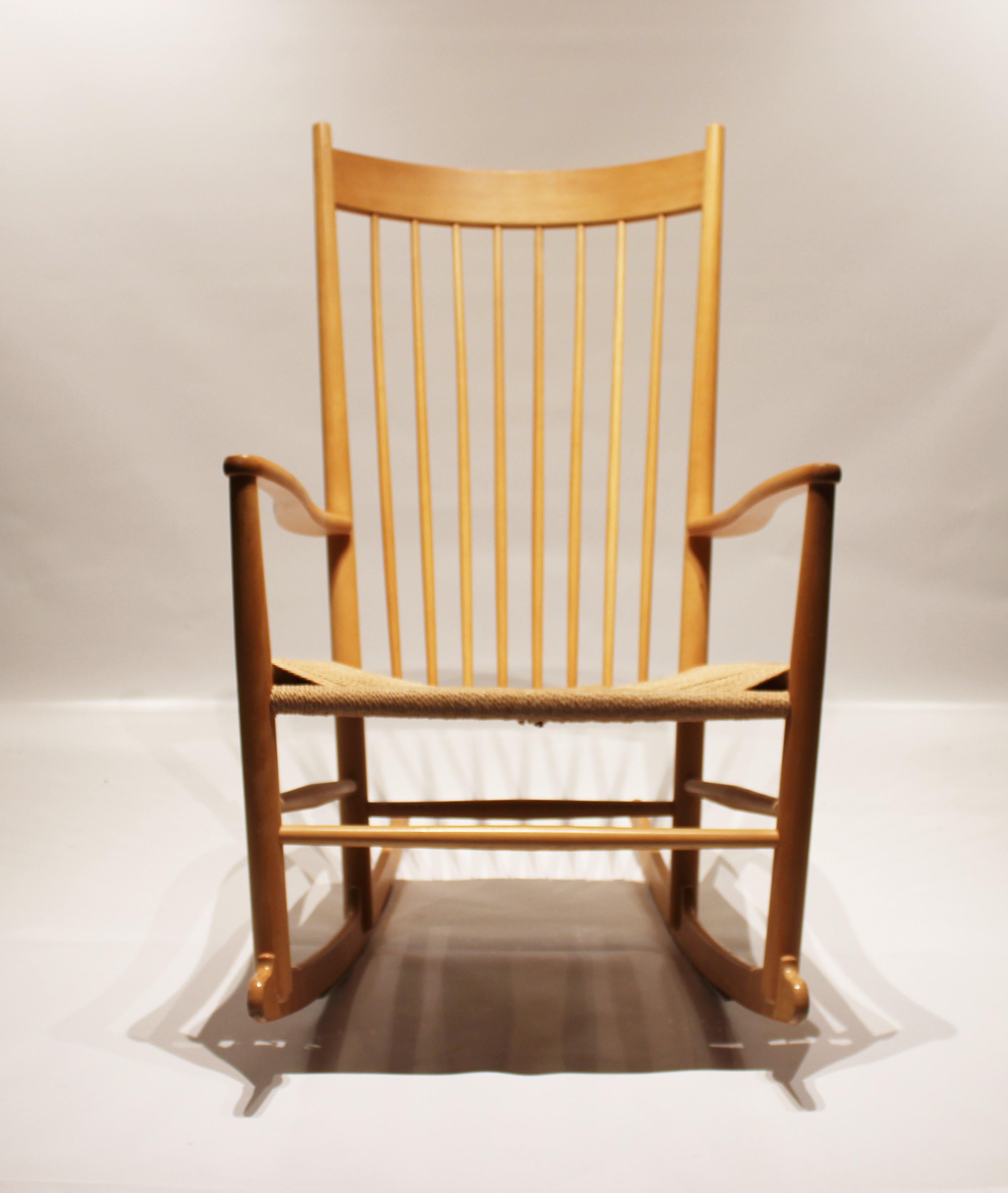 Rocking chair, model J16, of beech and seat of paper cord designed by Hans J. Wegner in 1944 and manufactured by Fredericia Furniture in the 1960s. The chair is in great vintage condition.