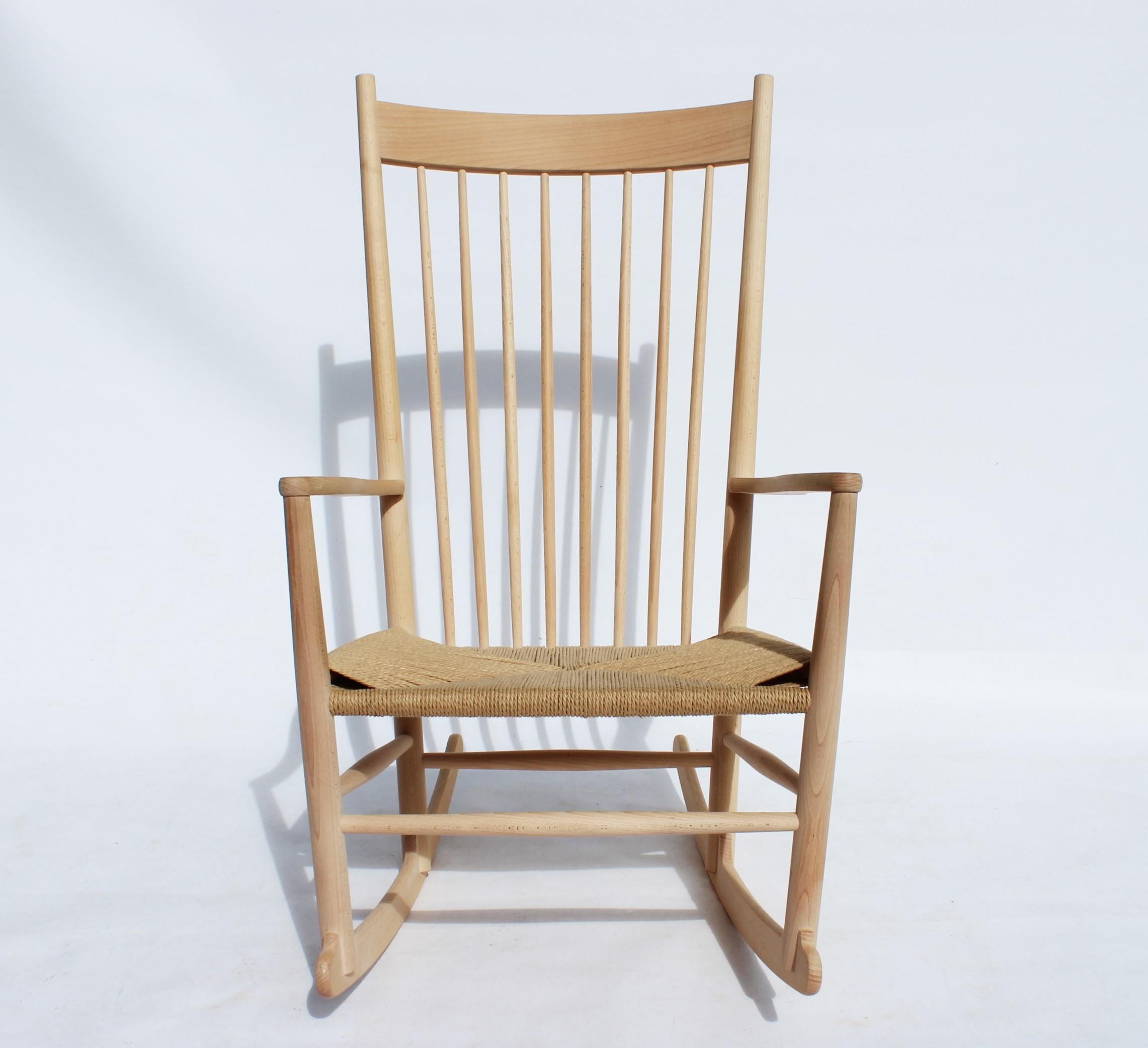 Rocking chair, model J16, of beech and paper cord, designed by Hans J. Wegner in 1944 and manufactured by Fredericia Furniture. The chair is in great vintage condition.