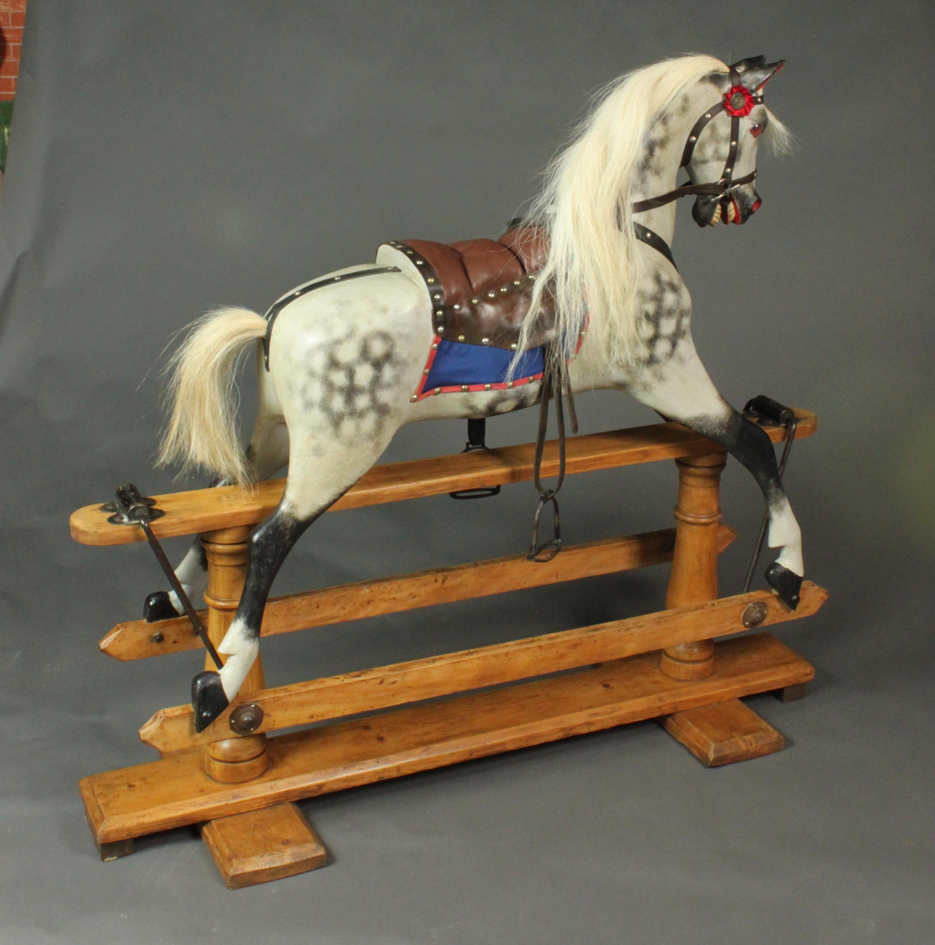 Hasrestored three rocking horses ready for Christmas.
This is the earliest and most elegant of the three and was made by Lines Brothers in circa 1920.
It is the Sportiboy model and is on a wooden stand with turned pillars and the head is slightly