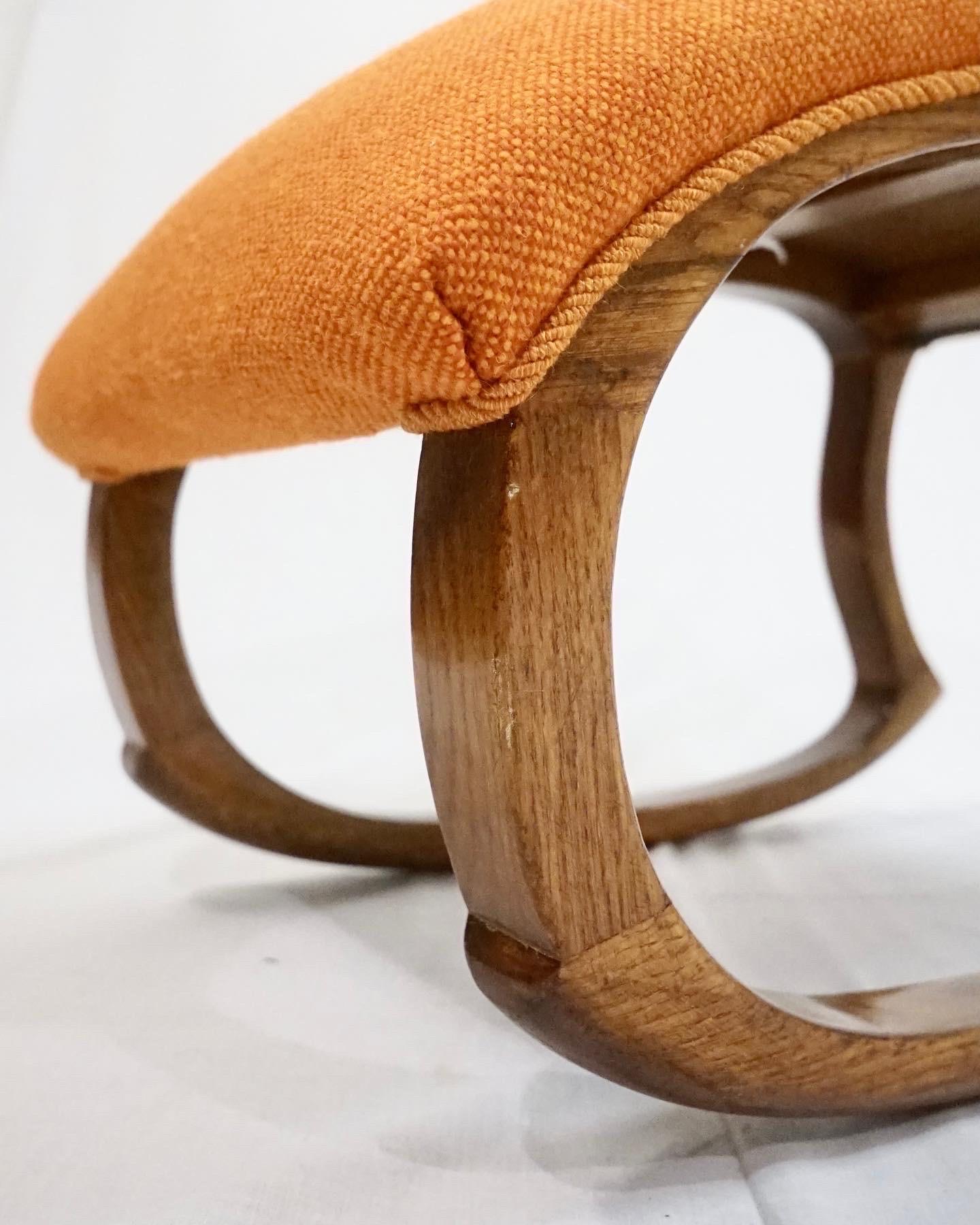 Rocking stool model 16 in dark stained oak and new wool upholstery by Danish designer Alfred Christensen for Slagelse Møbelværk. The stool is in good condition with light signs of use, and with a new upholstery in orange Hallingdal wool done by a
