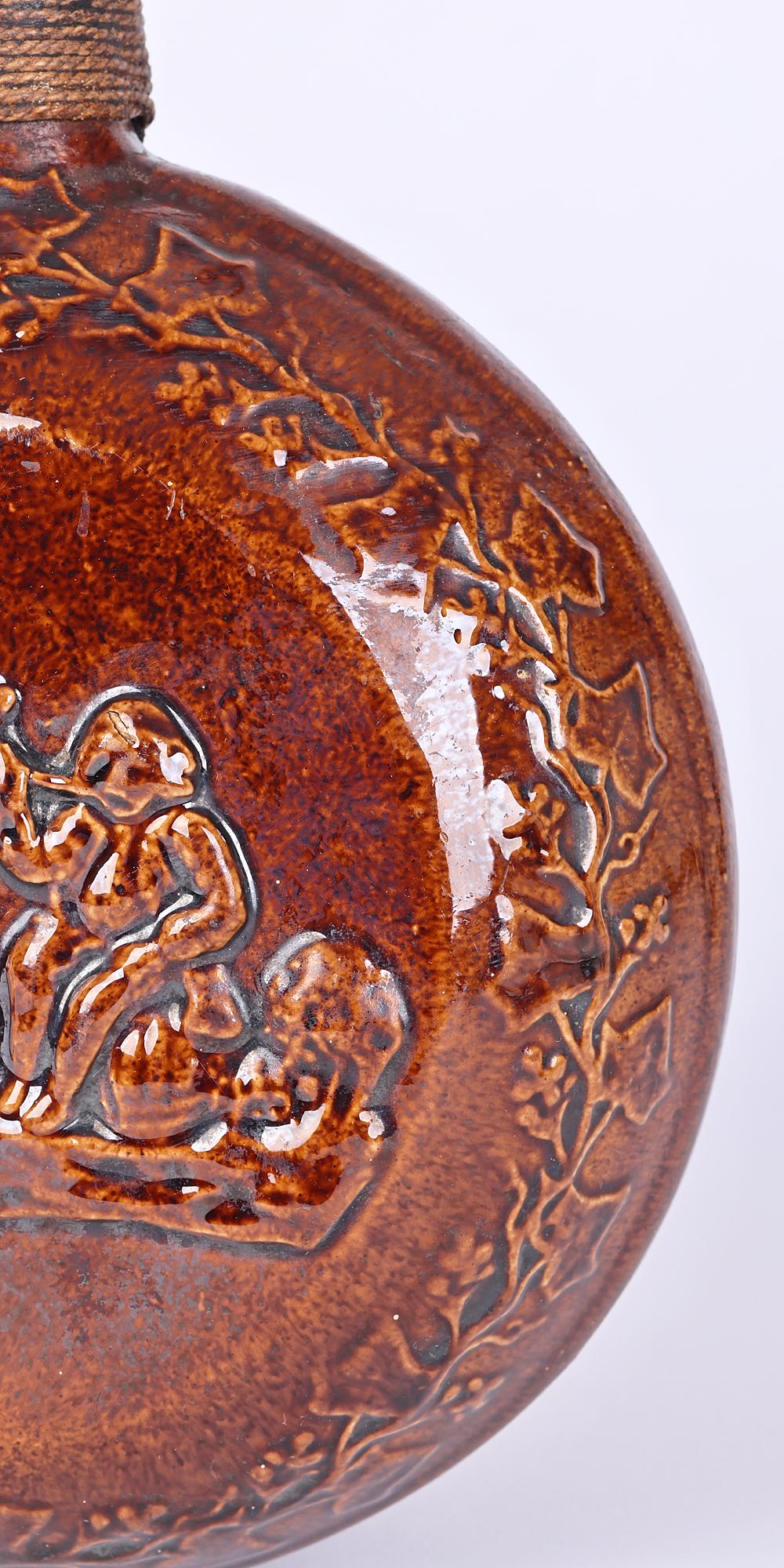 English Rockingham Rare Treacle Glazed Smoking Scene Pottery Flask For Sale