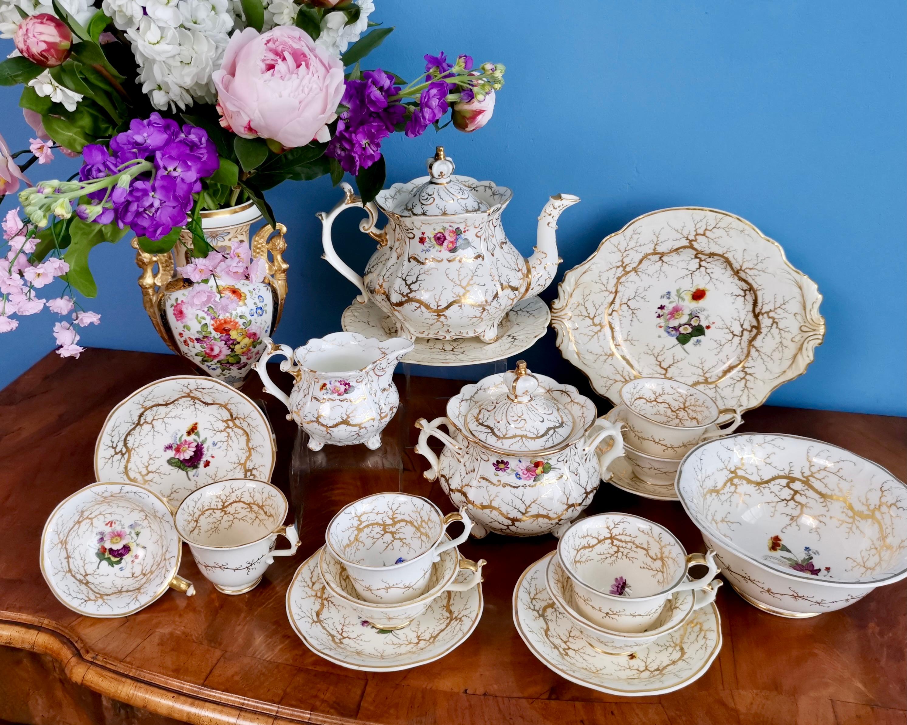 On offer is a rare and stunning full tea service made by Rockingham in about 1832. The service consists of a large teapot with cover and a stand, 4 teacups, 4 coffee cups, 4 saucers, a milk jug, a sucrier with cover, a large slop bowl and a cake