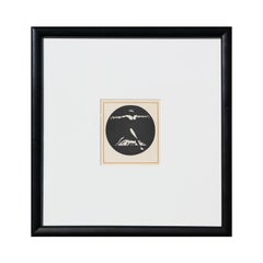 Circular Black & White Art Deco Print of a Striding Man with His Arms Raised