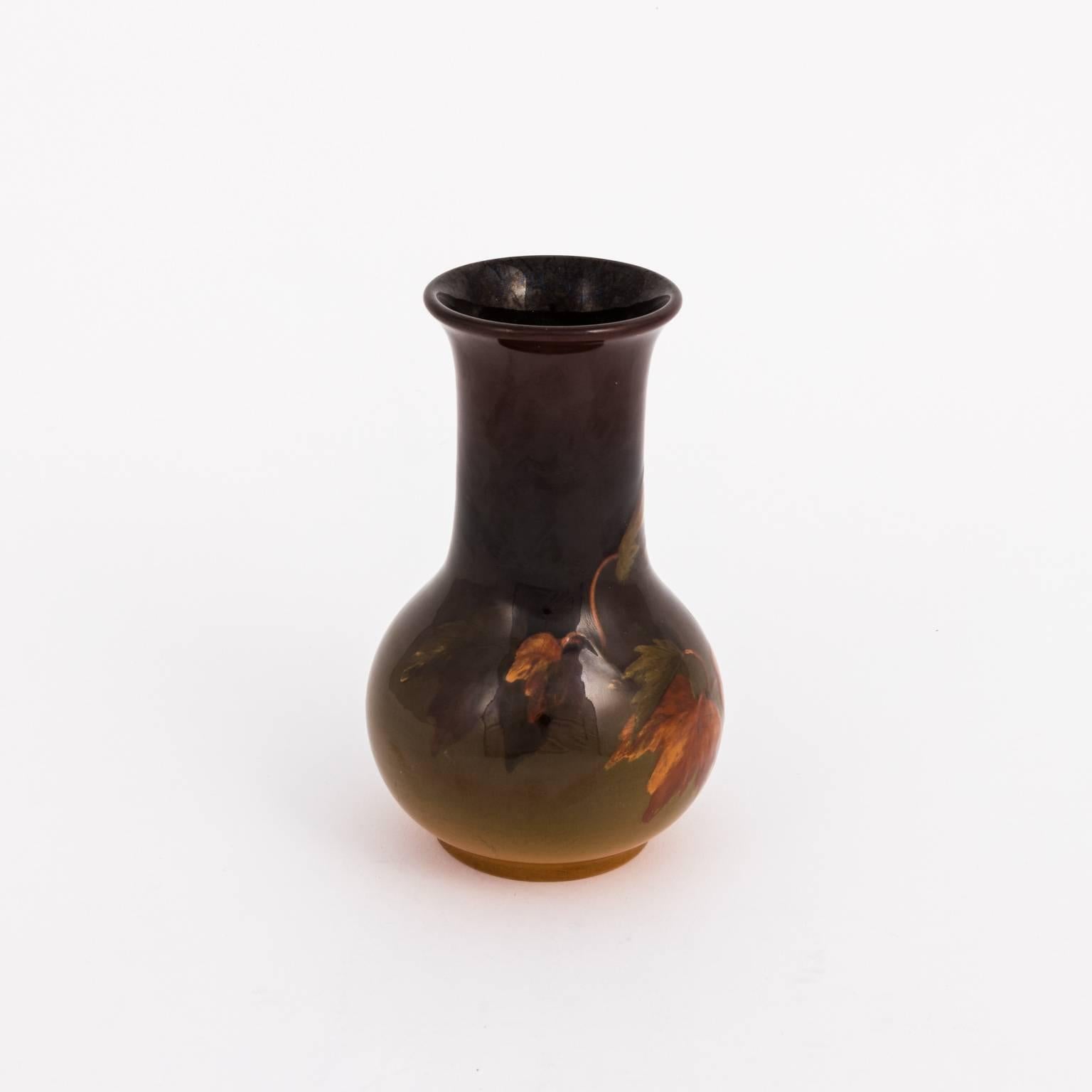 Rockwood pottery vase signed by Clara Windeman that features decorative leaves of autumn in a glazed finish, circa 1898.
 
