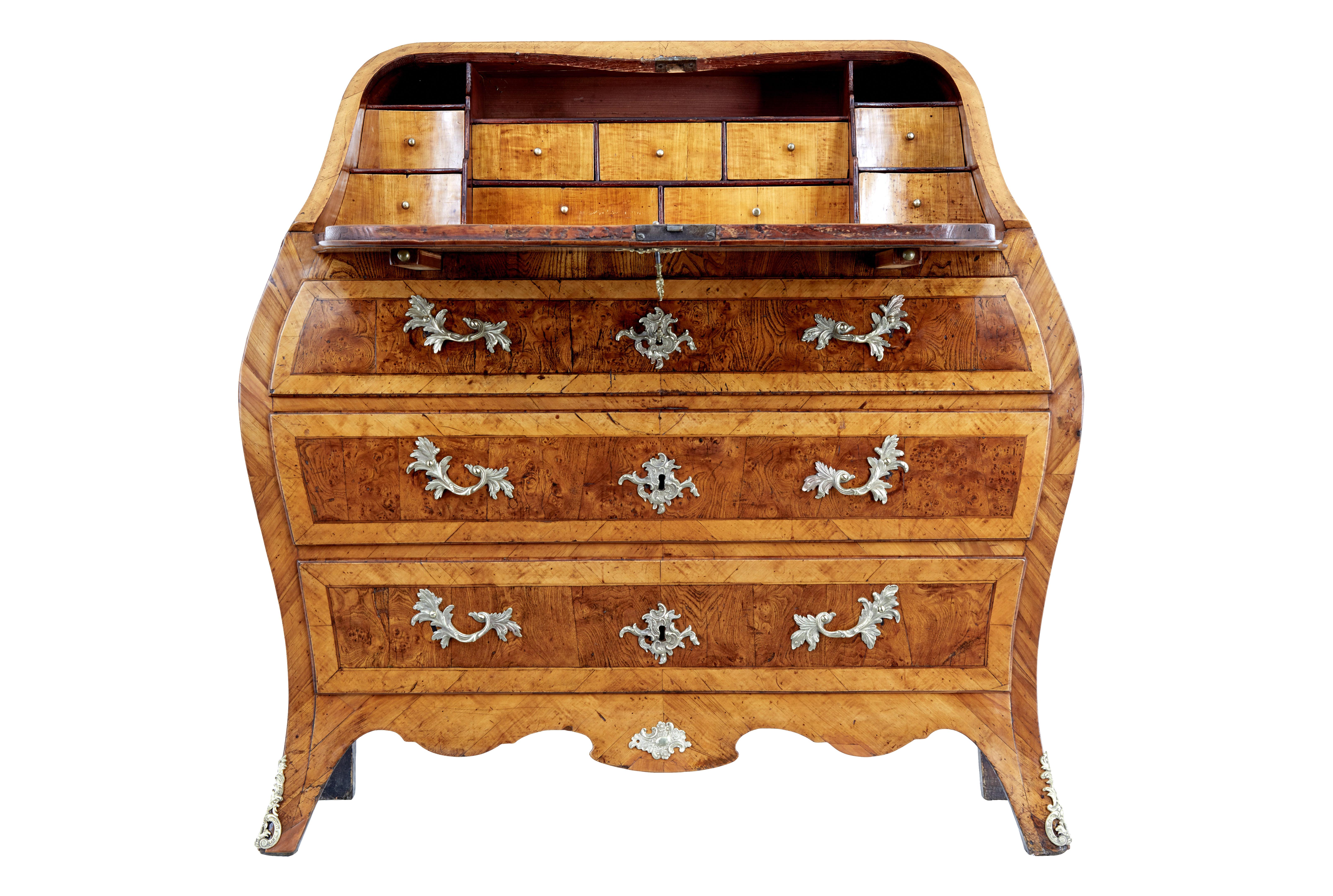 Rococo 18th century yew and elm bureau desk circa 1750.

Stunning Swedish rococo period bombe shaped bureau.   Beautifully made from yew wood and elm, using various techniques such as parquetry, inlay and cross banding.

Top surface and sides