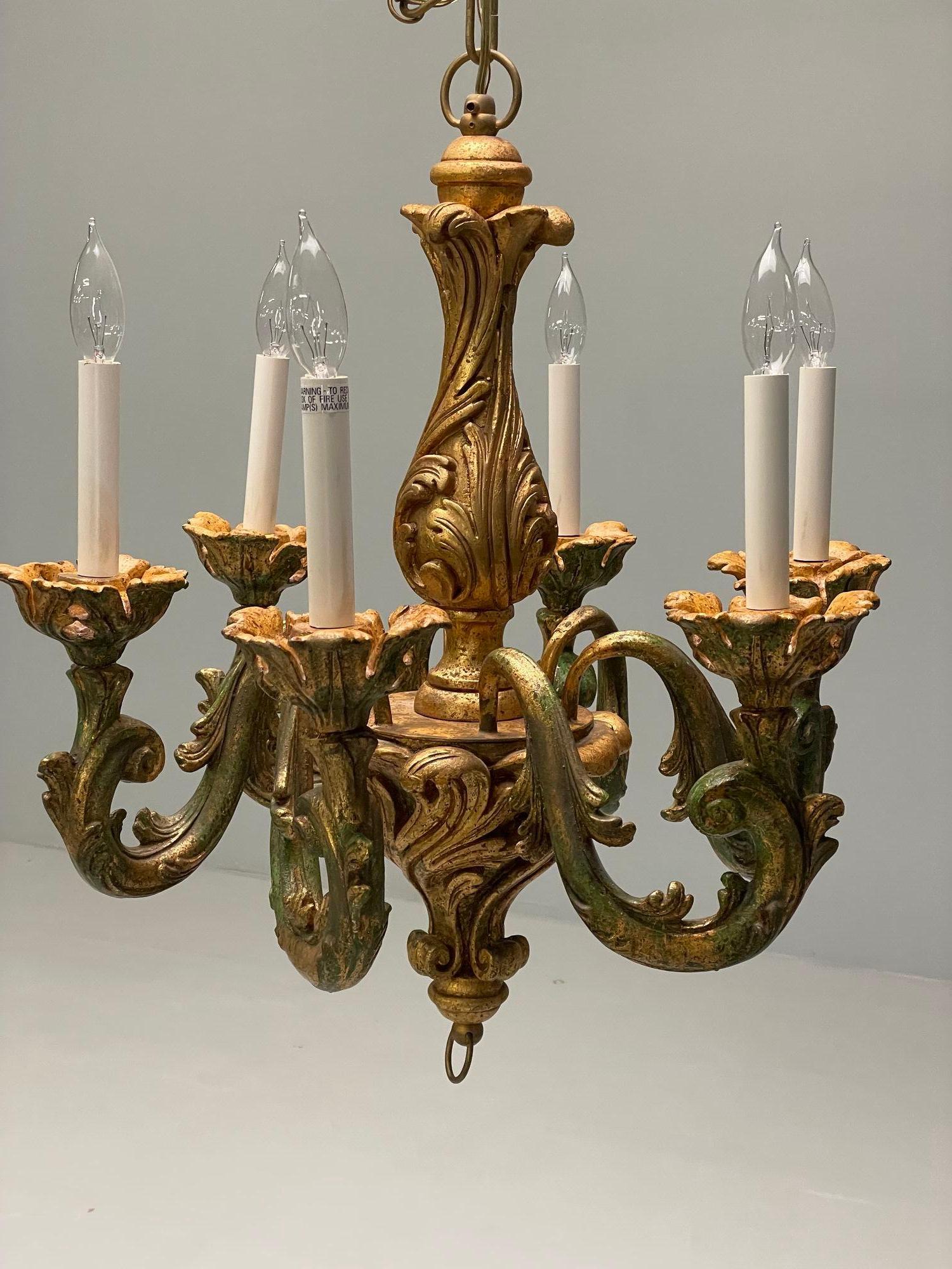 Rococo, Baroque, Italian Six Light Chandelier, Parcel Paint, Gilt, Italy, 1970s

A fine Rococo framed chandelier made in Italy having six lights on a finely carved frame having green and gilt decorated design. The whole having a matching chain and