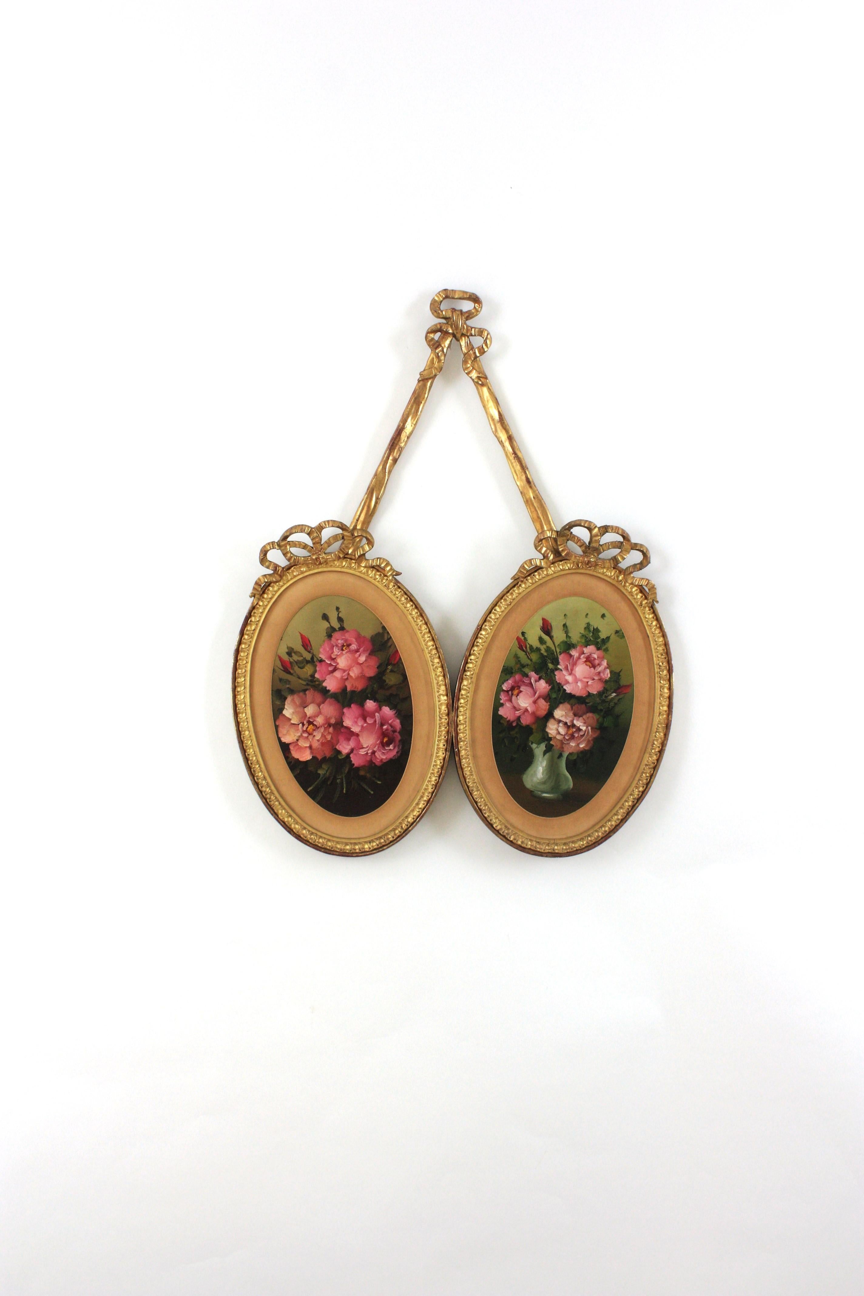 Espagnol Cadre double ovale rococo en bois doré avec peintures florales en vente