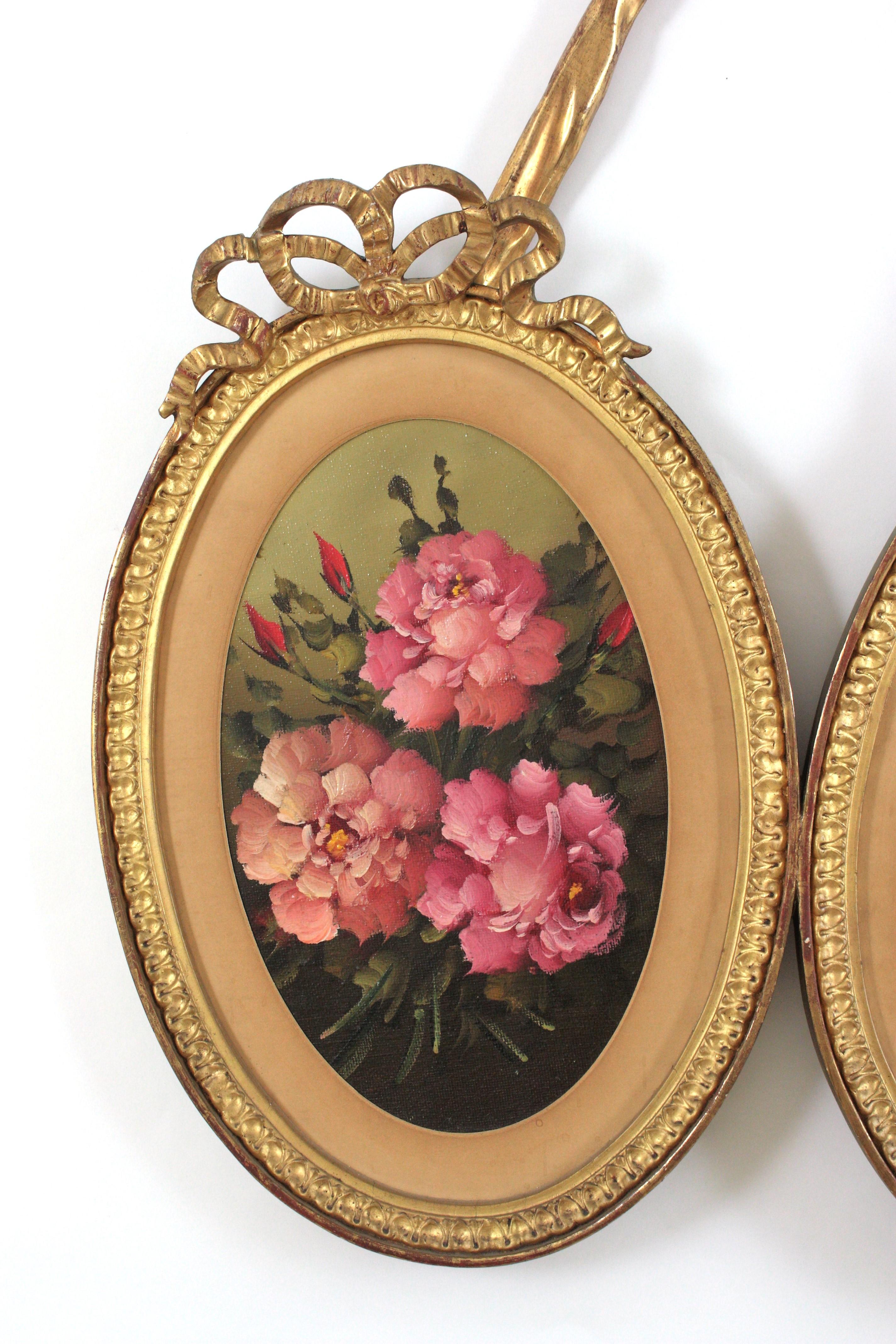 20ième siècle Cadre double ovale rococo en bois doré avec peintures florales en vente
