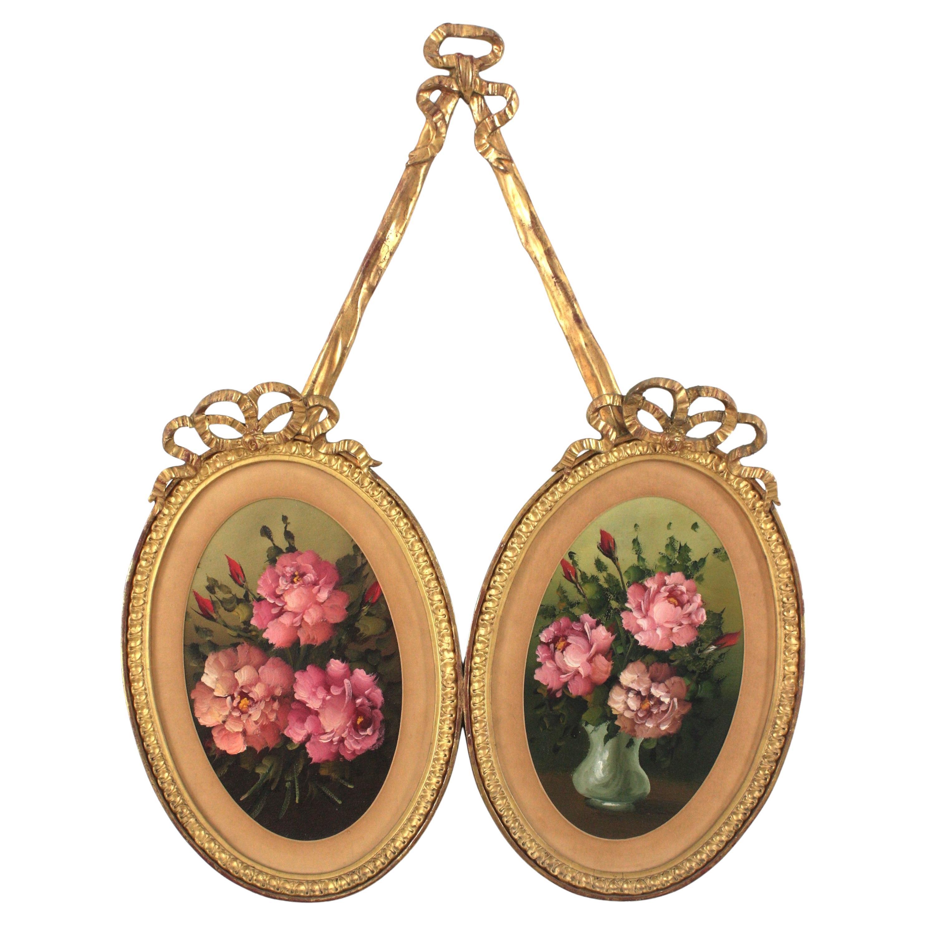 Cadre double ovale rococo en bois doré avec peintures florales en vente
