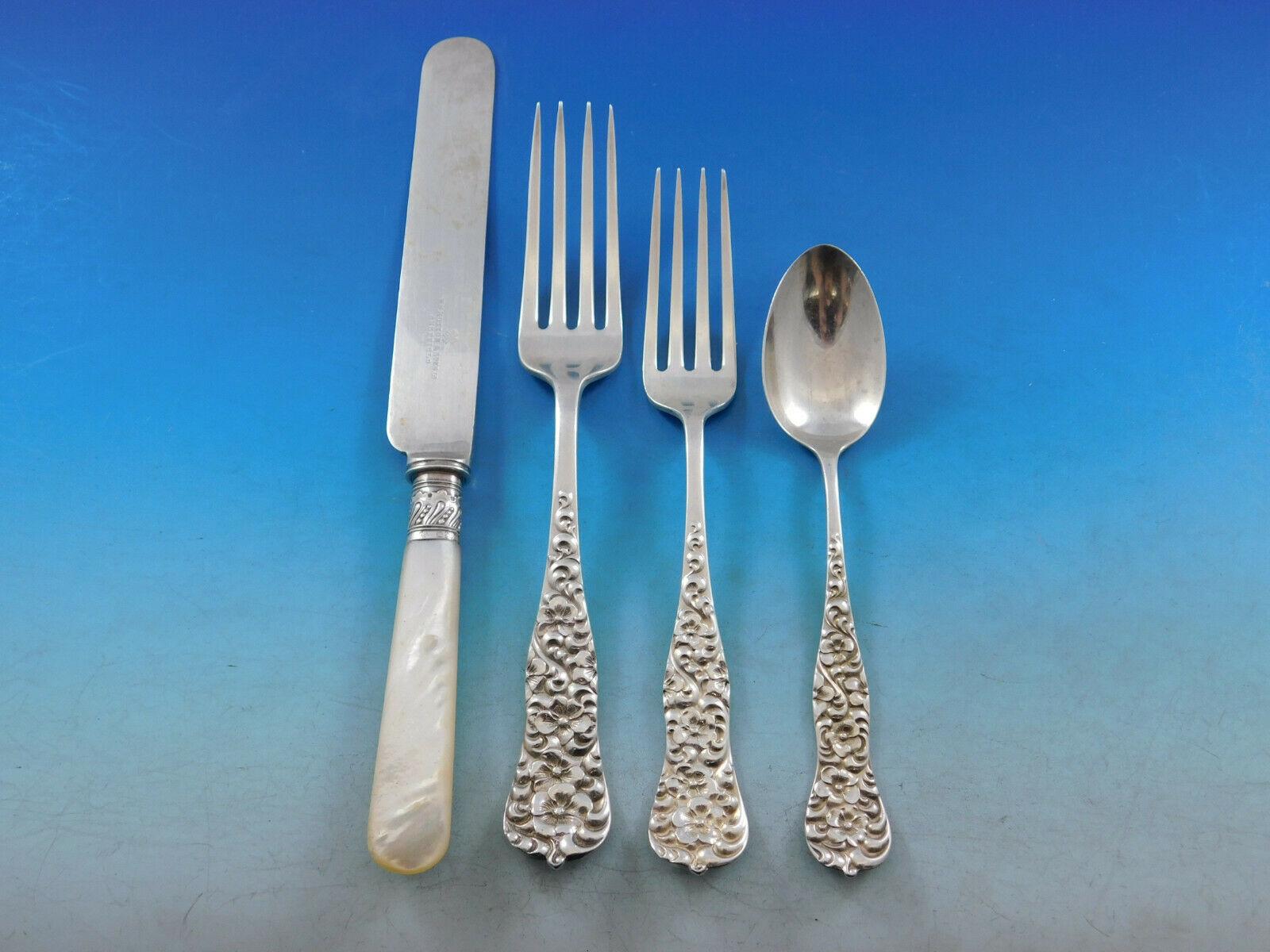 Dinner Size Rococo by Dominick & Haff, circa 1888, Sterling silver Flatware set, 72 pieces. This scarce set includes:

12 Dinner knives, 9 3/8