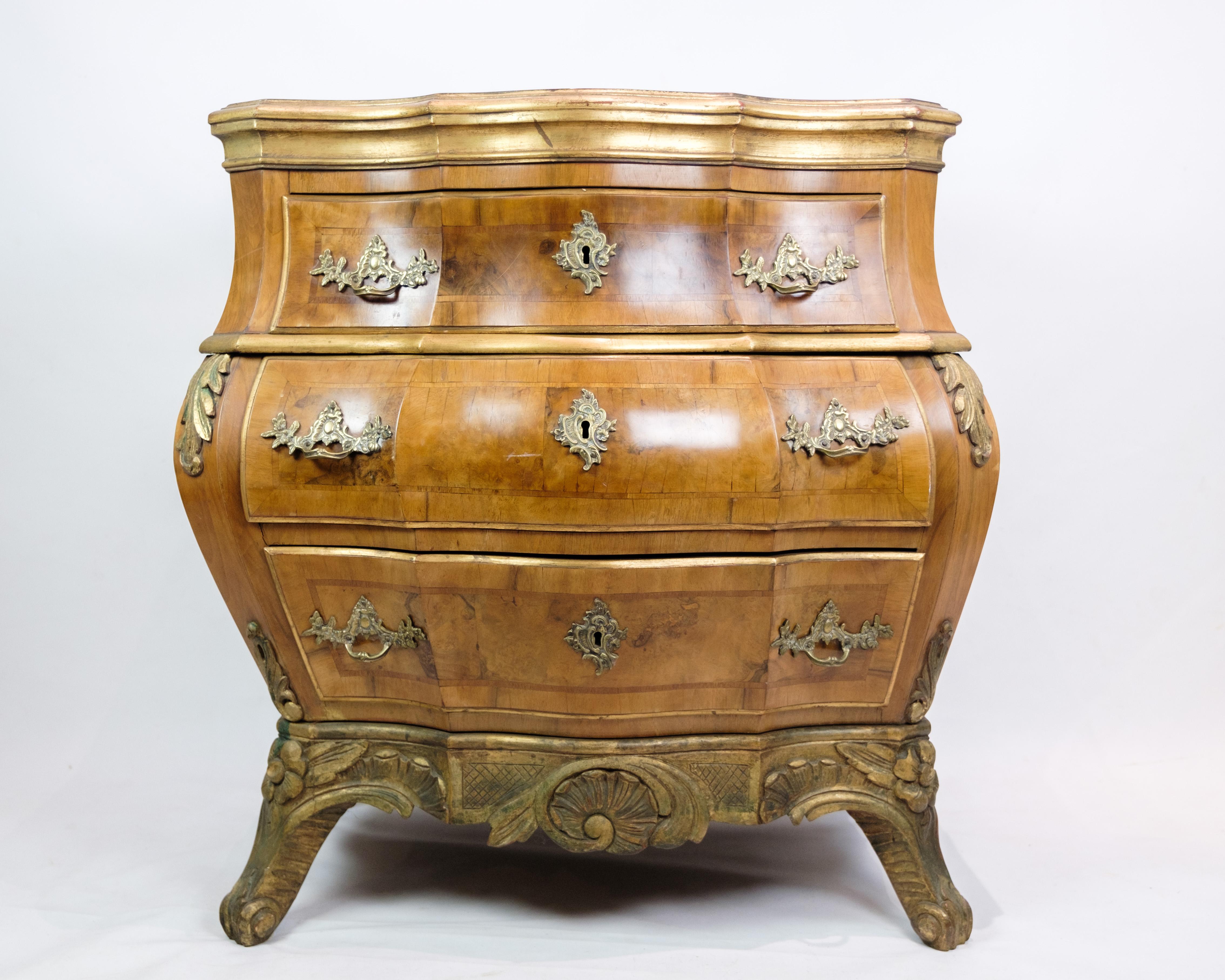 Bring an antique elegance into your home with this rococo bombé-shaped walnut dresser of Danish origin, dating to around the 1880s. This chest of drawers represents an era of opulent design and craftsmanship characteristic of the Rococo style.

The