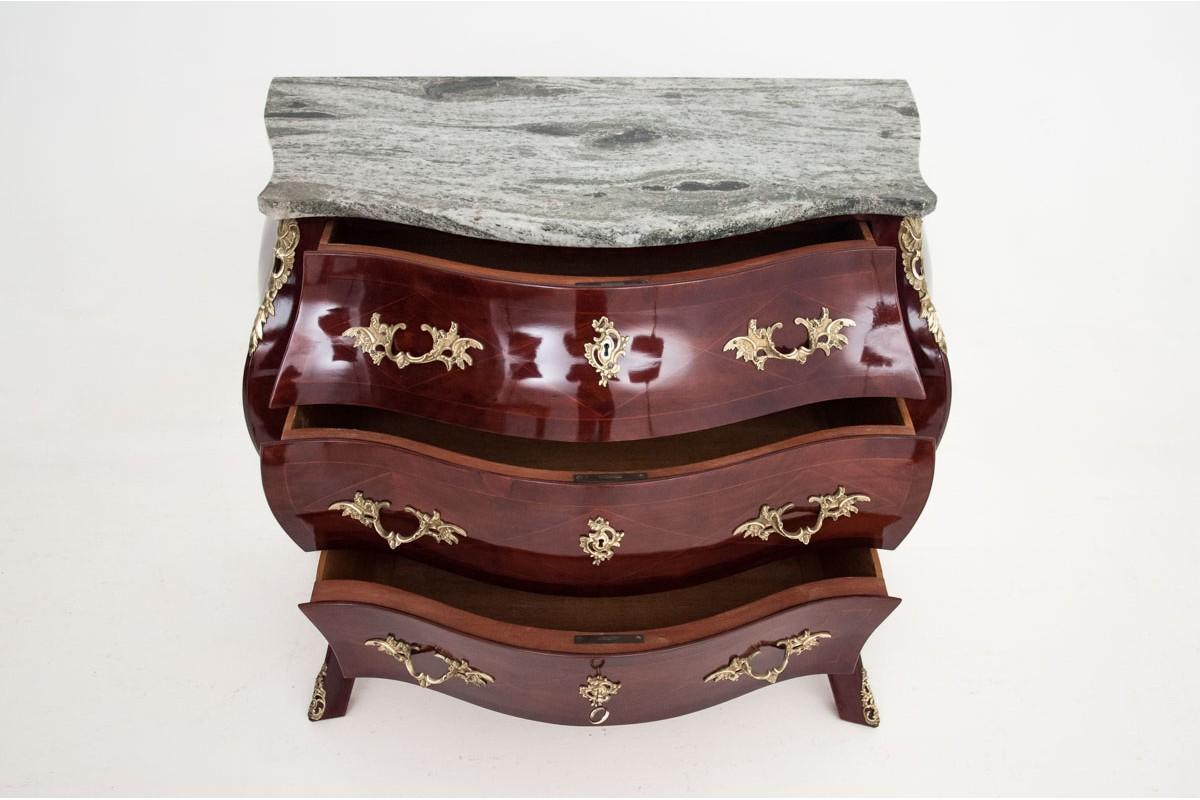 Elegant chest of drawers, Rococo style belly, finished with politron after renovation.

Wood: rosewood,

Year: circa 1920

Origin: Northern Europe,

Dimensions: height 82 cm, width 98 cm, depth 52 cm.