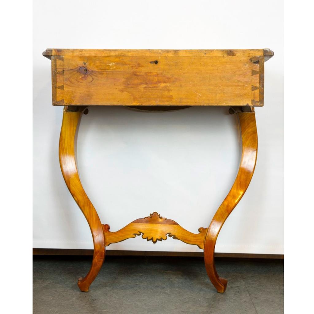 Rococo console table made of cherrywood, German, second half of the 18th century
This is an elegant console table made of cherrywood with curved frame and cartouche decorations on the legs. Made in the southern part of Germany in the second half of