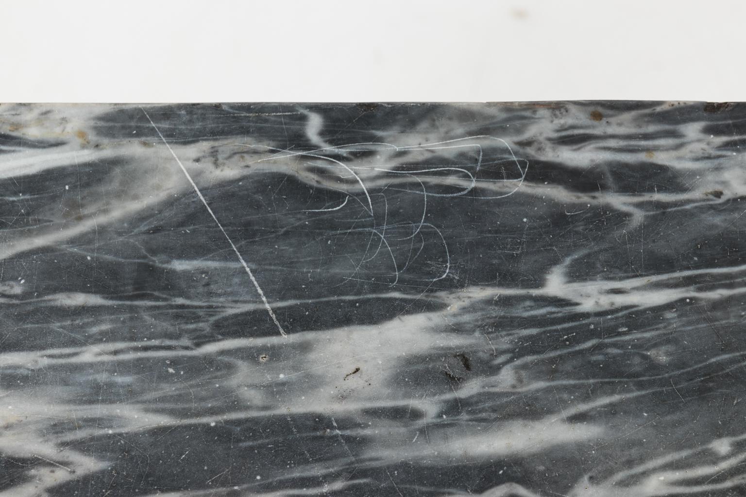 Swedish Rococo style giltwood console table with marble top and blue painted skirt circa late 18th century. The piece also features laurel leaves and turned legs. Please note of wear consistent with age along with heavy scratches to the tabletop.