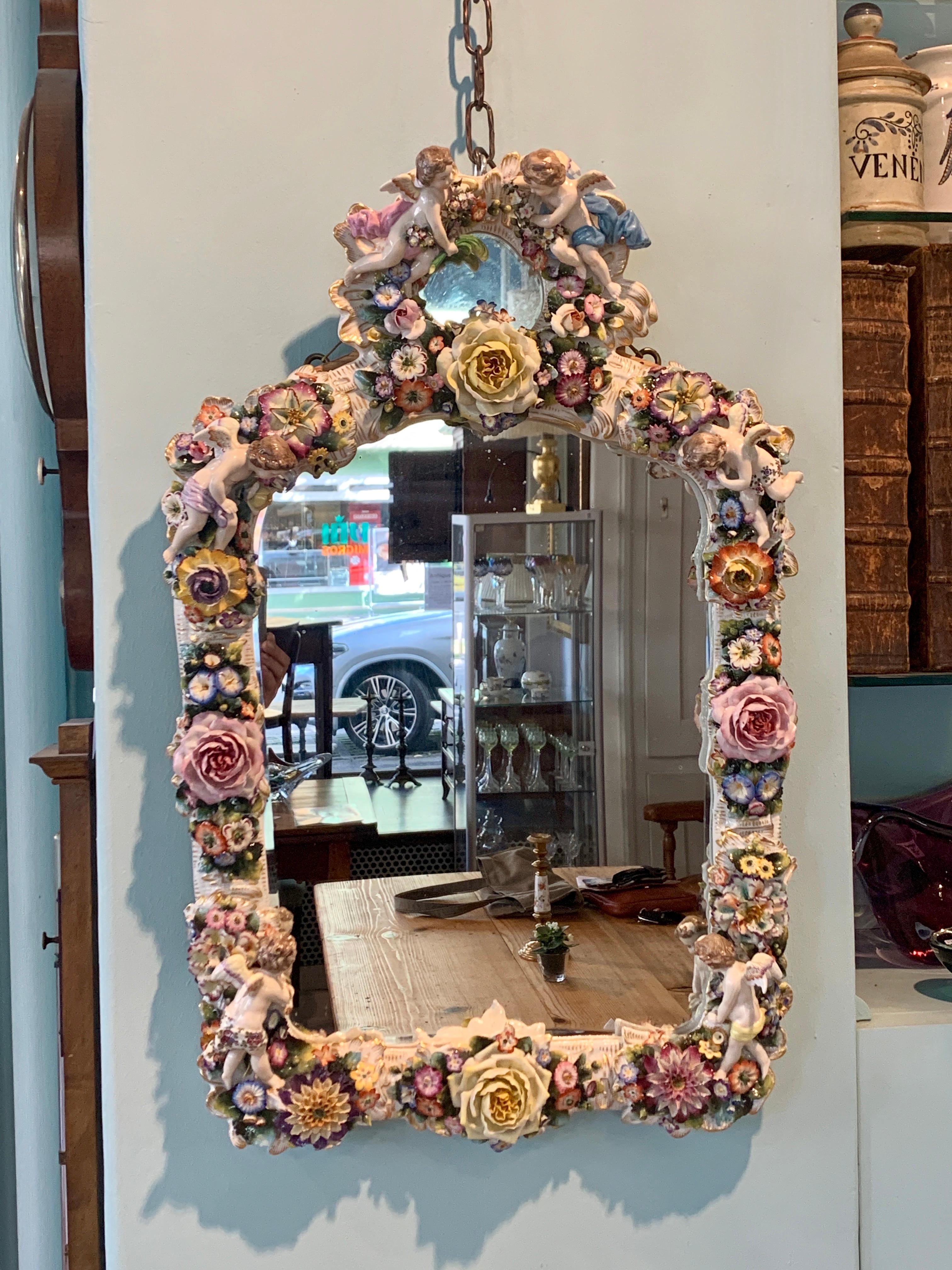 Certified unique Thuringia late 19th century in excellent condition curved Rococo-shaped mirror, porcelain frame set with rose tendrils.
Probably Meissen.
Exceptional piece!
 
