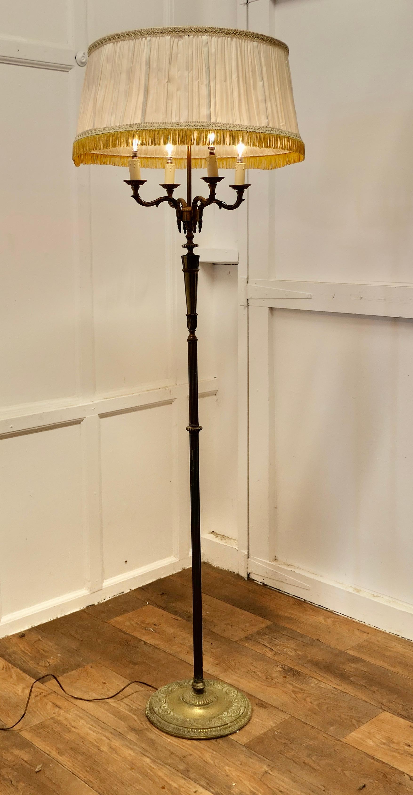 Rococo Gilt Brass Candelabra 4 Branch Floor Lamp, Standard Lamp

This is an elaborate and very attractive piece, the lamp has a decorative upright set on a round base this supports a 4 branch candelabra 
The lamp comes with an original silk shade,
