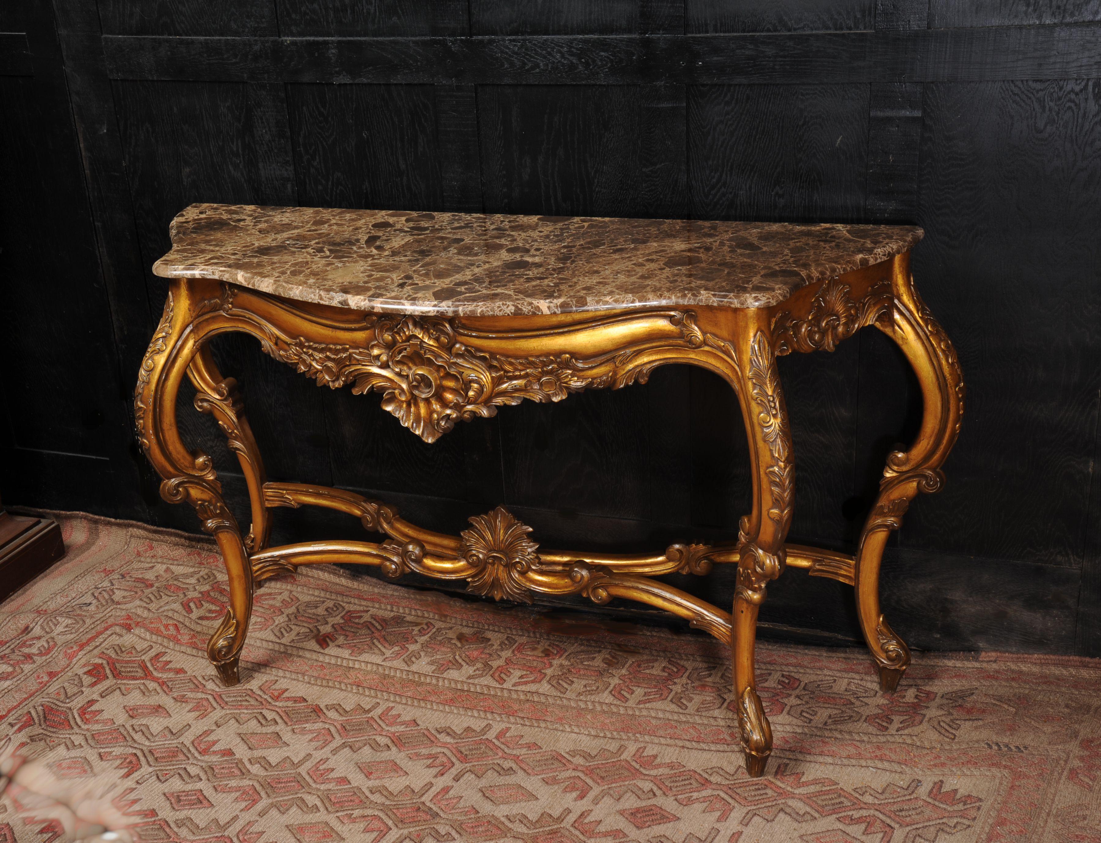A lovely large serpentine Rococo console table with marble top. Vintage of some age with a great look. Marble has a good polish, some light scratches. We also have a mirror available that goes well with the table.