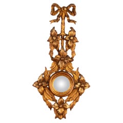 Specchio convesso in legno dorato rococò con fiocco e nastro