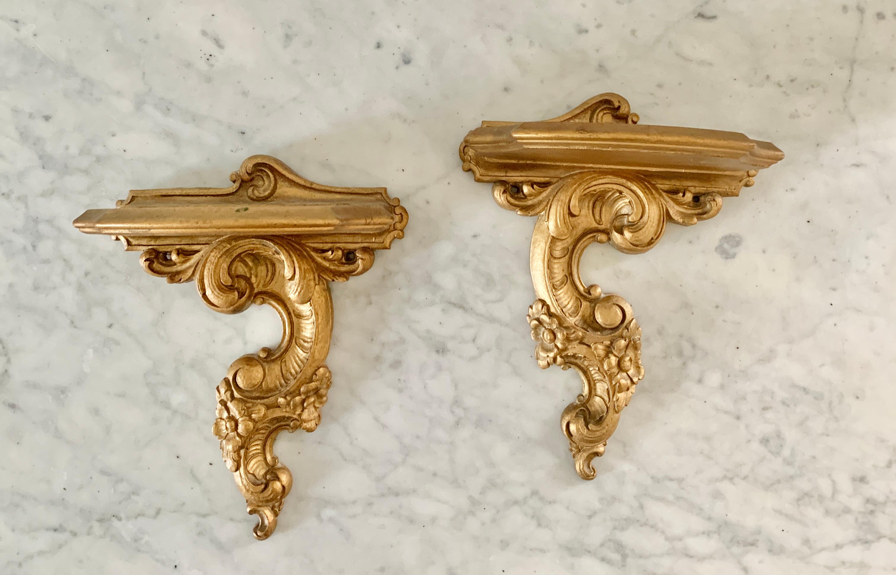 A gorgeous pair of neoclassical or Rococo style giltwood wall sconces or brackets

USA, circa Mid-20th Century

Measures: 6.75