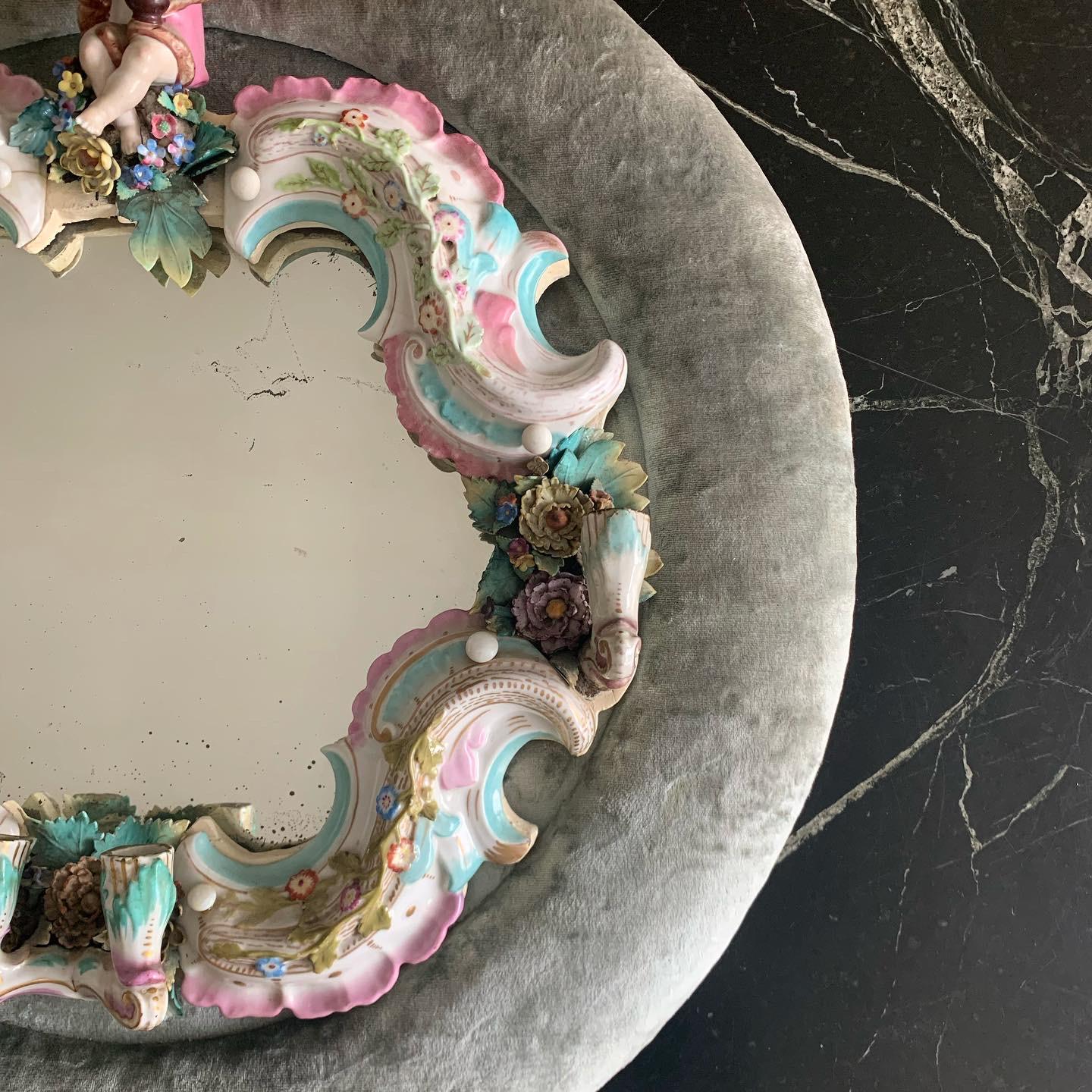 Baroque / Rococo girandole mirror / candelaria combo in Meissen enameled porcelain and gray crushed velvet. My wild guess is that the mirror portion is Viennese or German circa late 1800s and was later (perhaps about a century later, circa 1970s)