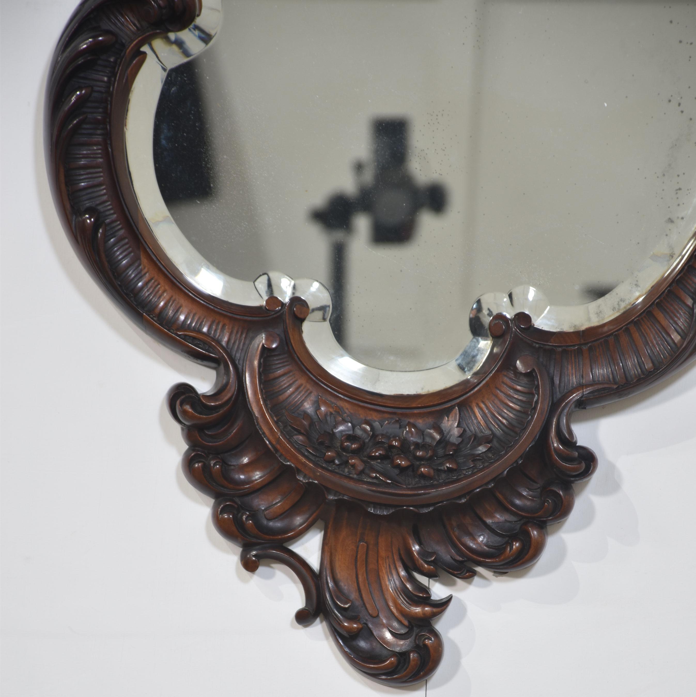 Wood Rococo Revival carved mahogany wall mirror For Sale