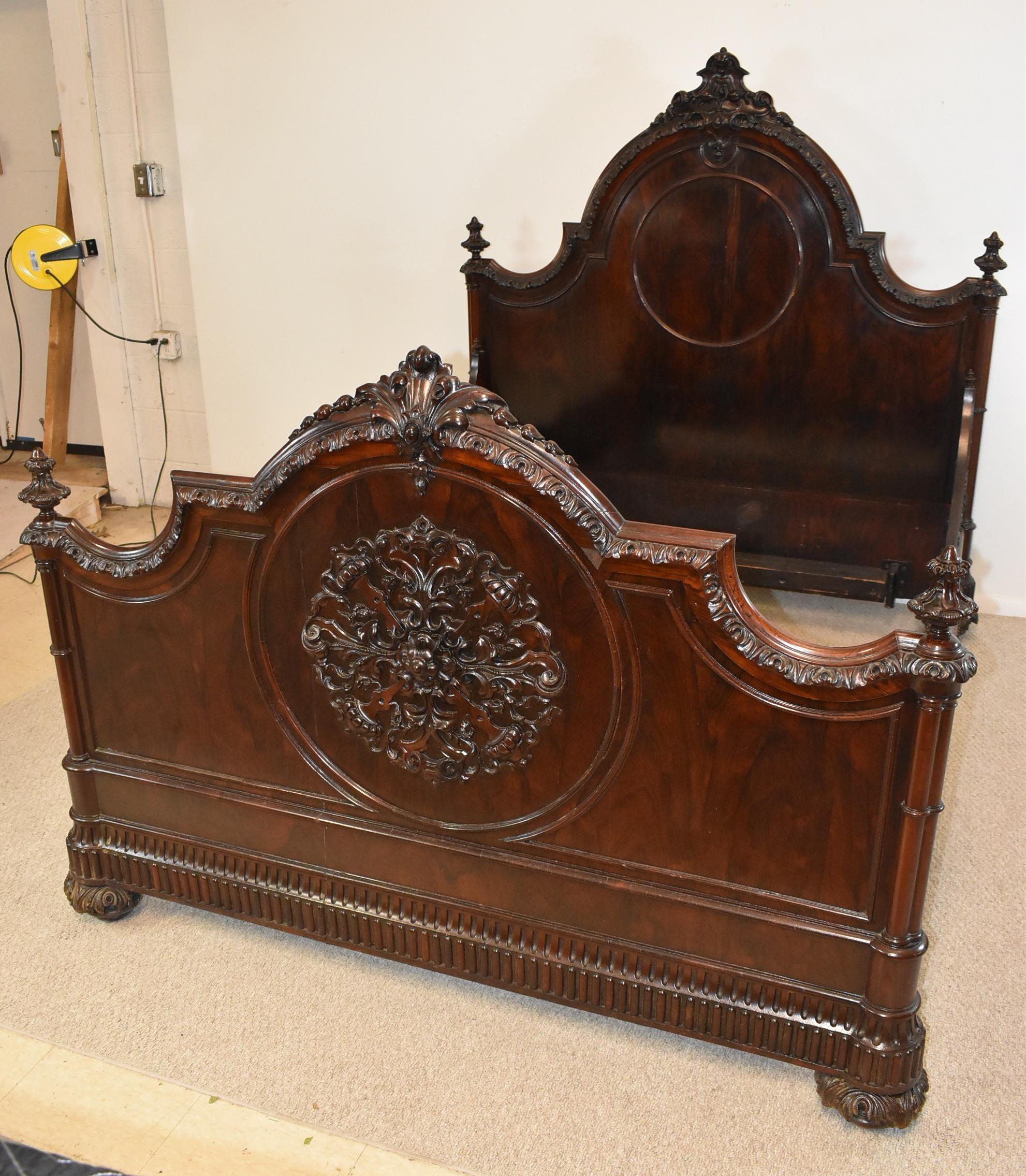 Beautiful Rosewood Bedroom Set, Queen size bed. Rococo styling with intricately carved medallions on the end of the bed and the door fronts. The trim work has rosettes along all of the edges. Detailed bottom edge, 4 finials, a large pediment, side