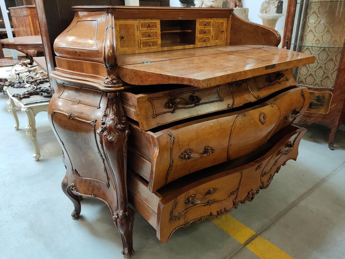 A very high-class woodcarving, effective neo-rococo Venetian secretary, made in a very interesting and rarely found in the trade form - a magnificent, locked, rococo chest of drawers with an opening, tilting table top.

The quintessence of the