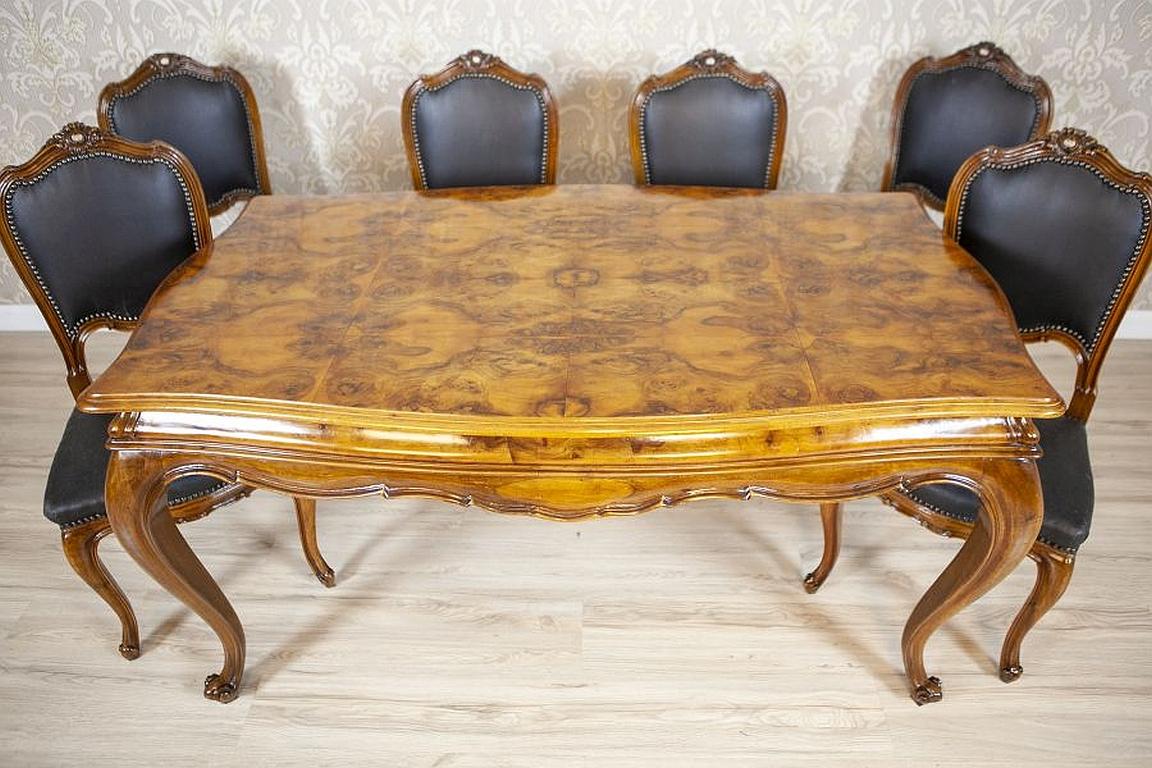 Rococo Revival walnut dining set from the early 20th century

We present you this dining set from the early 20th century composed of a table and 6 chairs.
The table with a rectangular top and a profiled wavy edge is supported on bent legs.
What