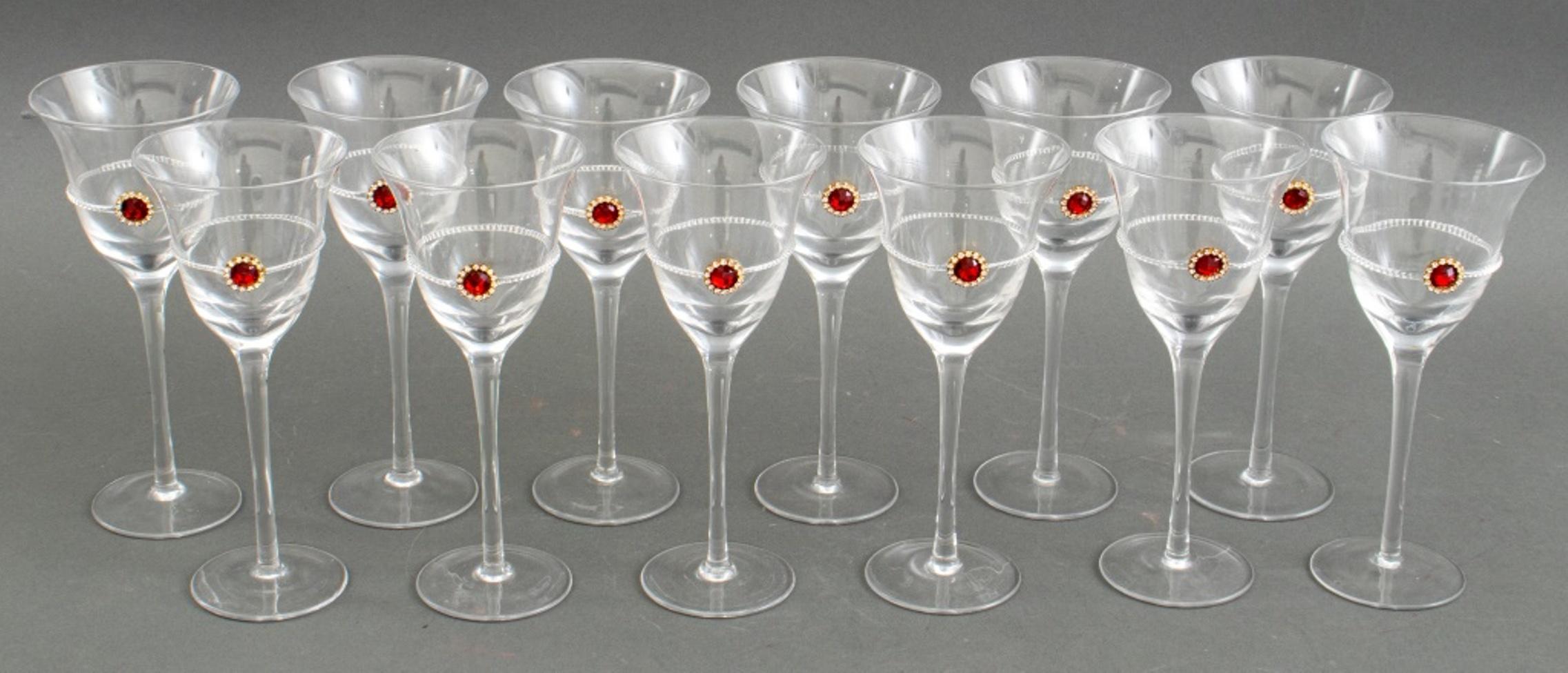 Set of (12) twelve Rococo Revival wine glasses with faux ruby and faux diamond decoration, apparently unsigned.

Dimensions: 8.75