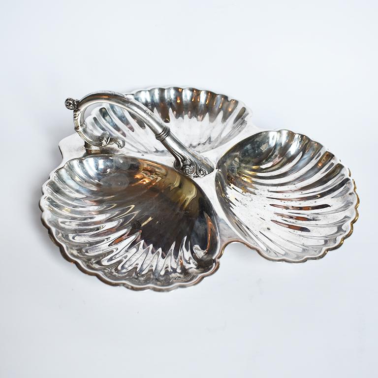 Silver-plated Italian Style Clamshell motif condiment or Hors D'oeuvre serving dish by Sheridan. This lovely open serving piece features three shells scooped bowls or wells affixed together with a handle at top. Each bowl is shell-shaped and